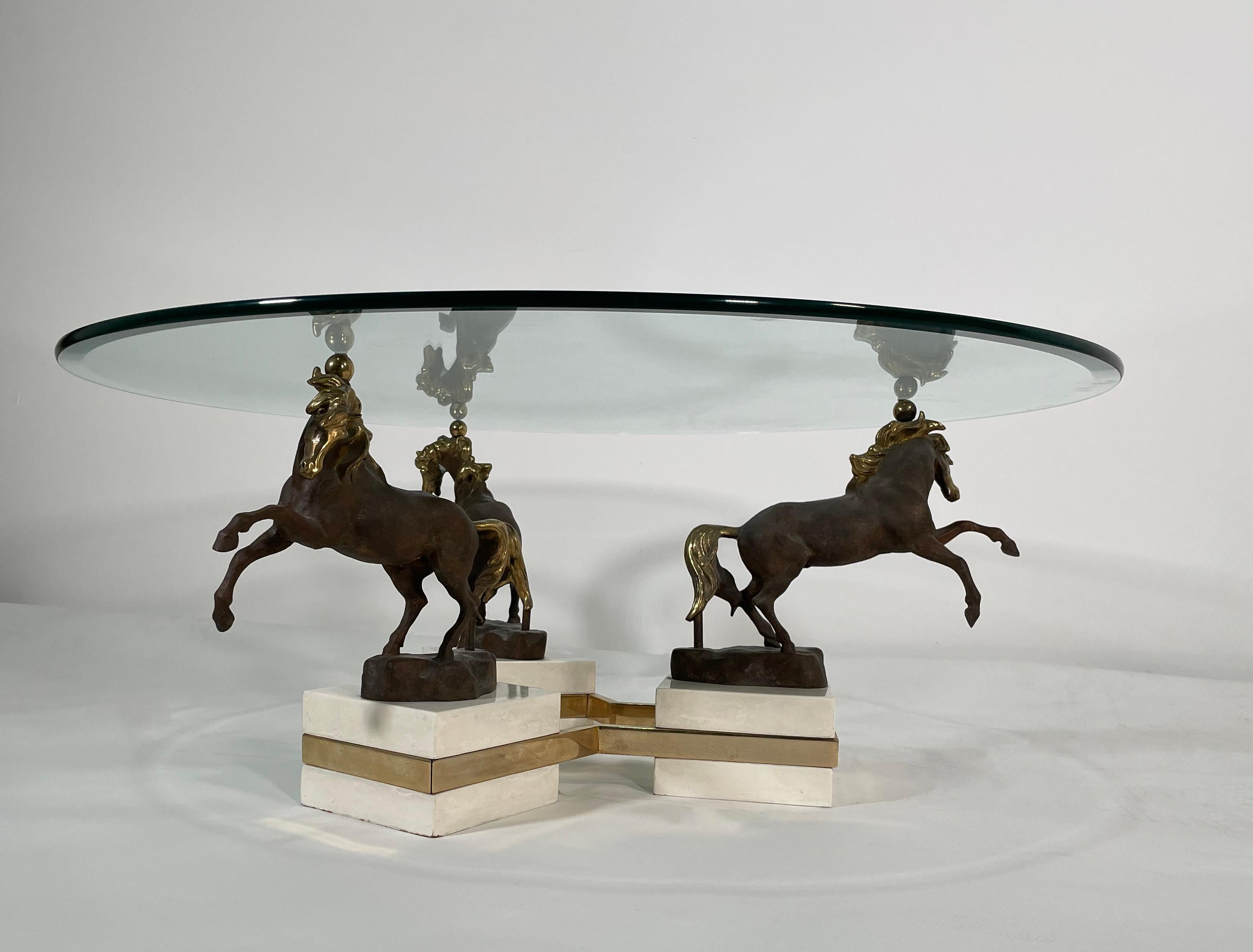 The glass top above 3 bronze rearing stallions, on a marble base banded with bronze- base measures 33' Diameter.