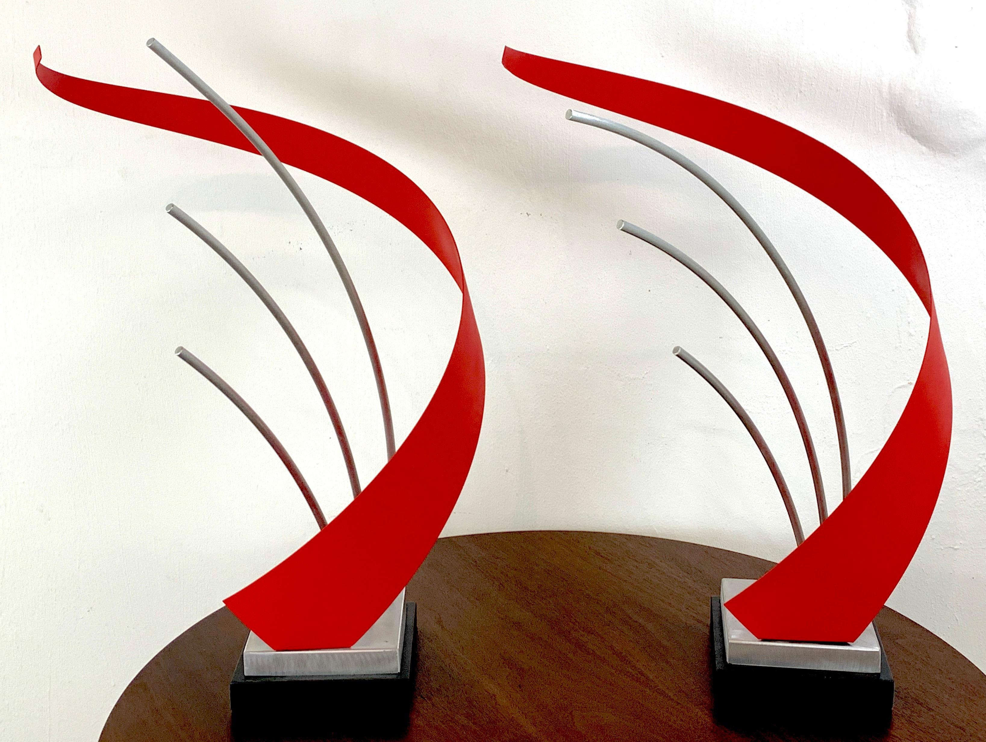 French modern enameled metal abstract sculpture, 2nd available
Dramatic and kinetic in feeling each one has red enameled spiral, flanking three bent rods, on square plinth base. Unsigned
Each work is raised a 7-inch square ebonized wood base.