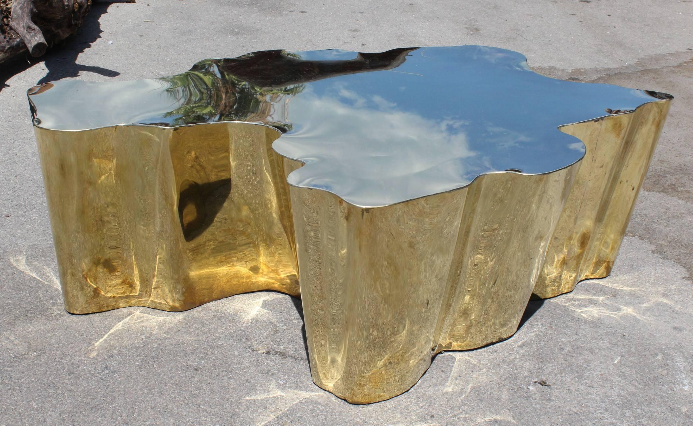 French modern gilded brass table in a golden finish.