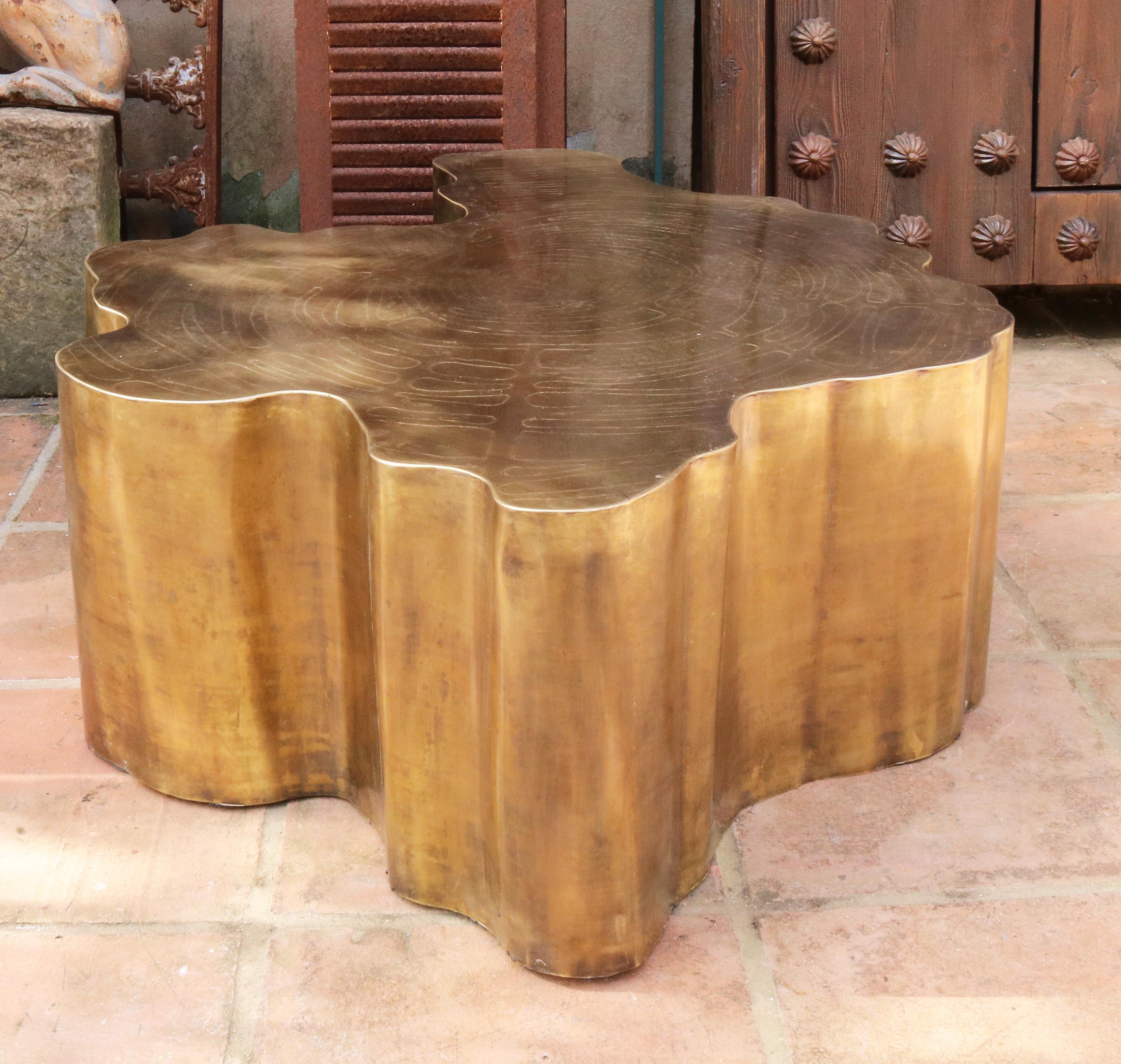 French modern gilded brass table in a golden matte finish.