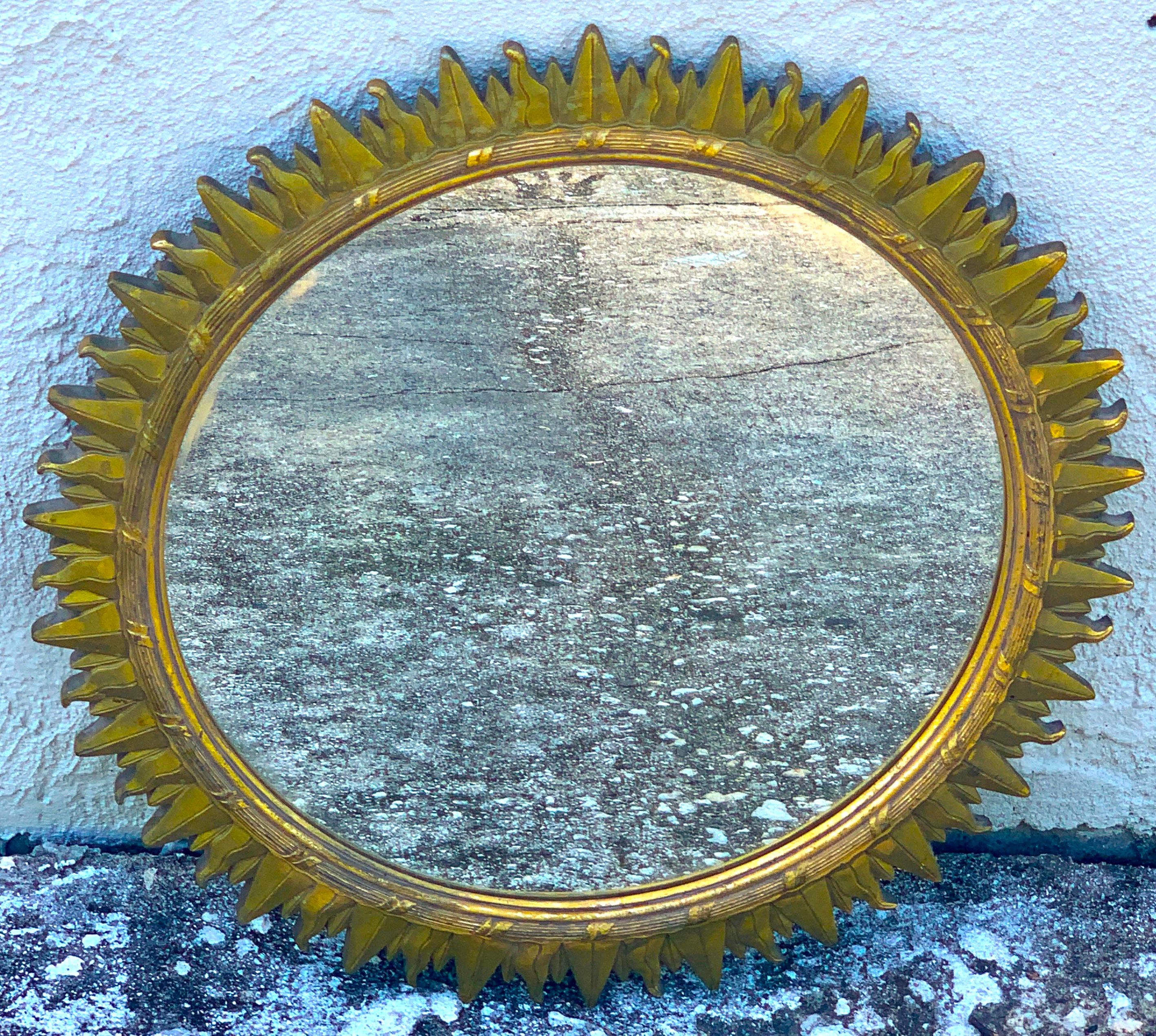 French modern giltwood sunburst mirror

Revel in the luxurious allure of our French Modern Giltwood Sunburst Mirror. This piece, hailing from 1940s France, displays a body of gesso and giltwood grace, exquisitely crafted into a captivating sunburst