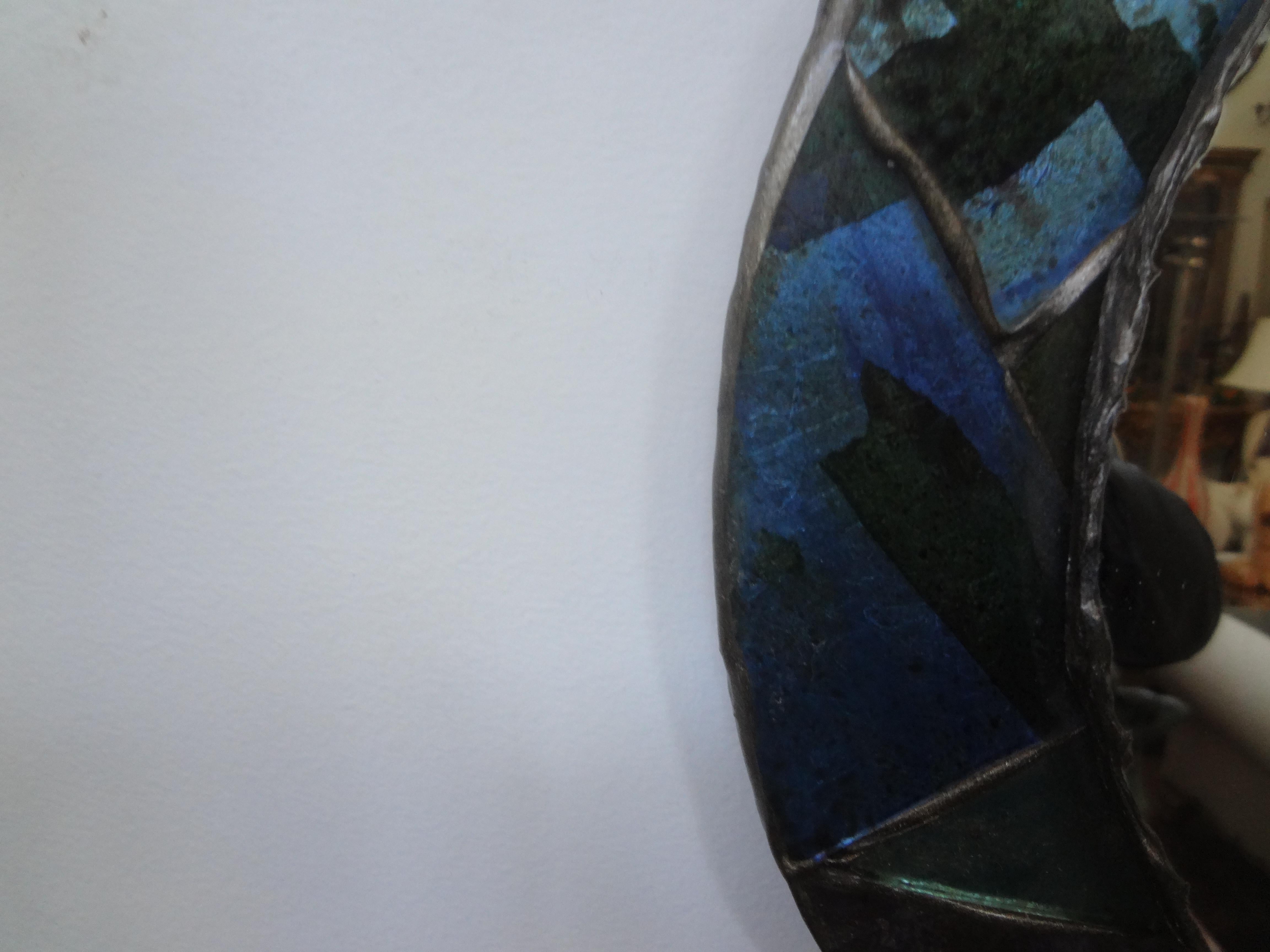 French Modern Glass Mosaic Mirror After Francois Lembo.
Our stunning mirror made of leaded mirrored glass in shades of blues and greens is very similar to the work of Francois Lembo. This French modern mirror would look great grouped together with