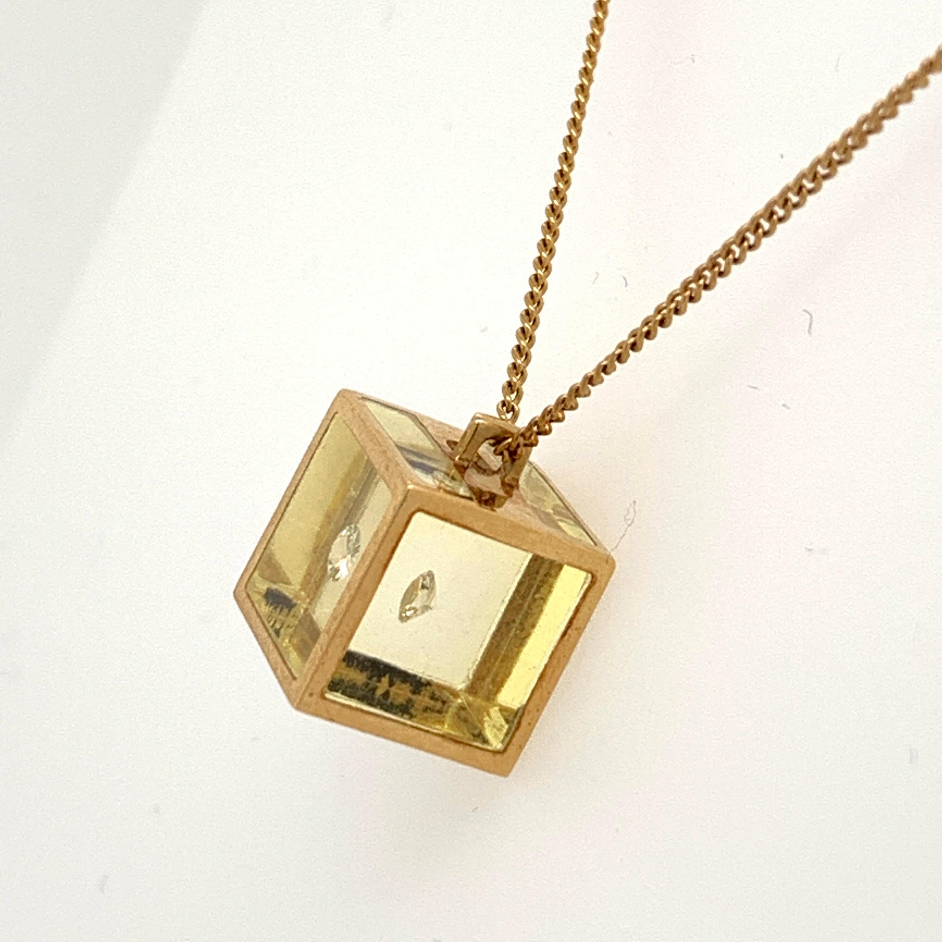 Original Pascal Morabito Cube and Diamond 18k Yellow Gold Pendant.

The chain is just over 15 1/2 inch and weighs 3.78 grams. The pendant is filled with resin and measures 9.3mm.  