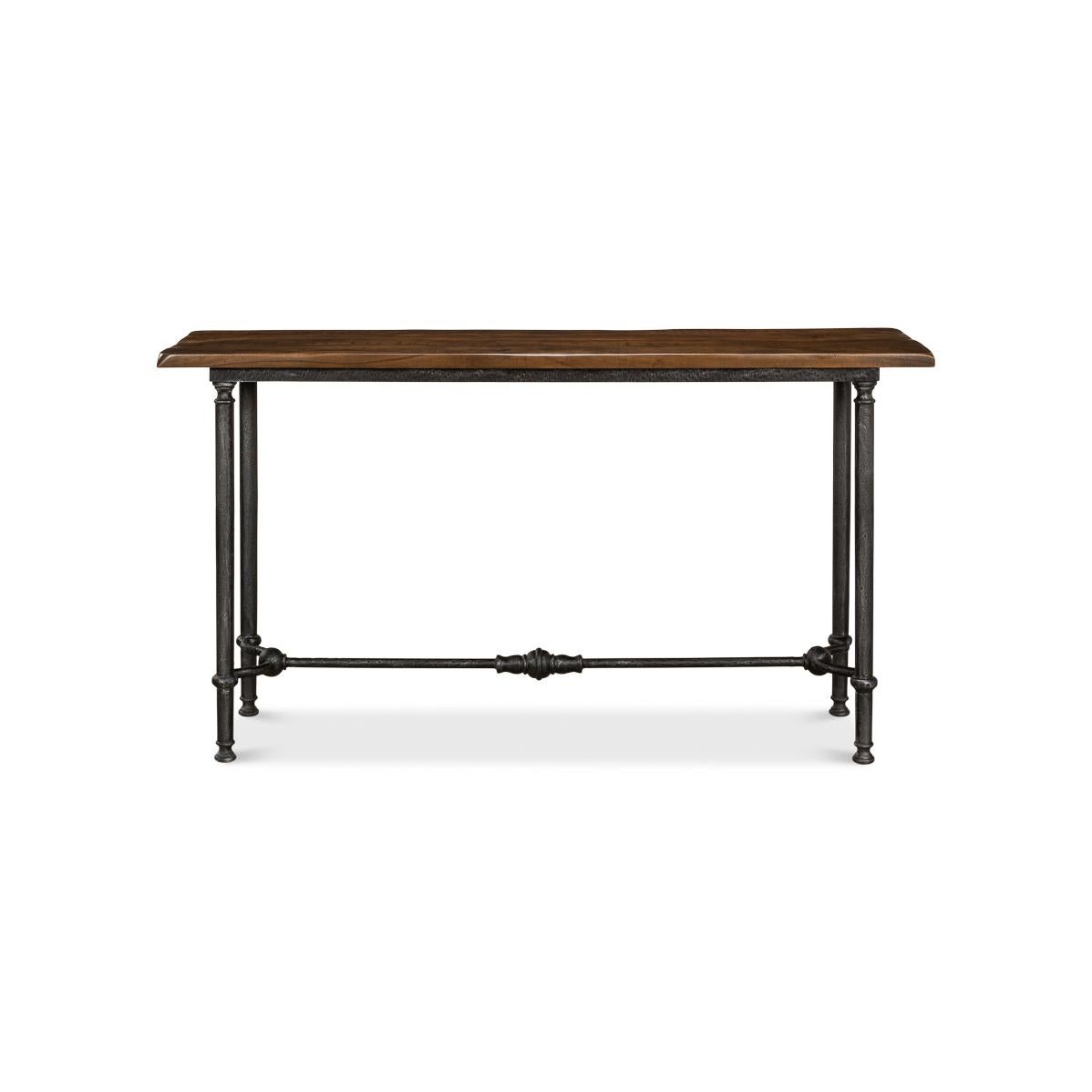 Featuring a solid walnut top, this console showcases the natural beauty and rich tones of premium wood, perfectly balanced by a hand-forged iron base. The slender yet sturdy legs, complete with intricate crossbar detailing, lend a timeless