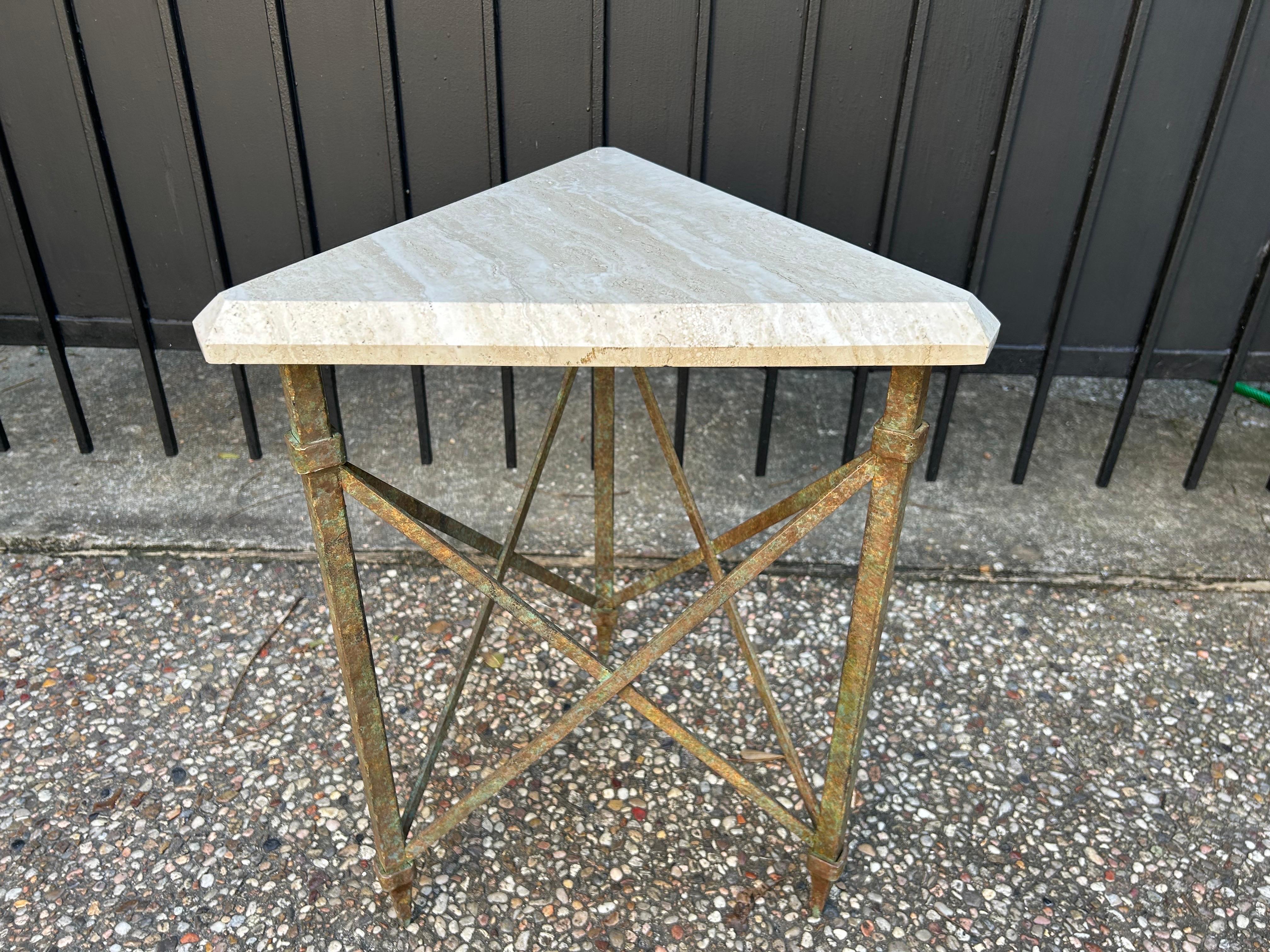 French Modern Iron And Travertine Table Inspired By Gilbert Poillerat.
Offered is a handsome French mid century triangular hand hammered iron table with a polished travertine top.
This fantastic table is versatile enough to be used in a Modernist,