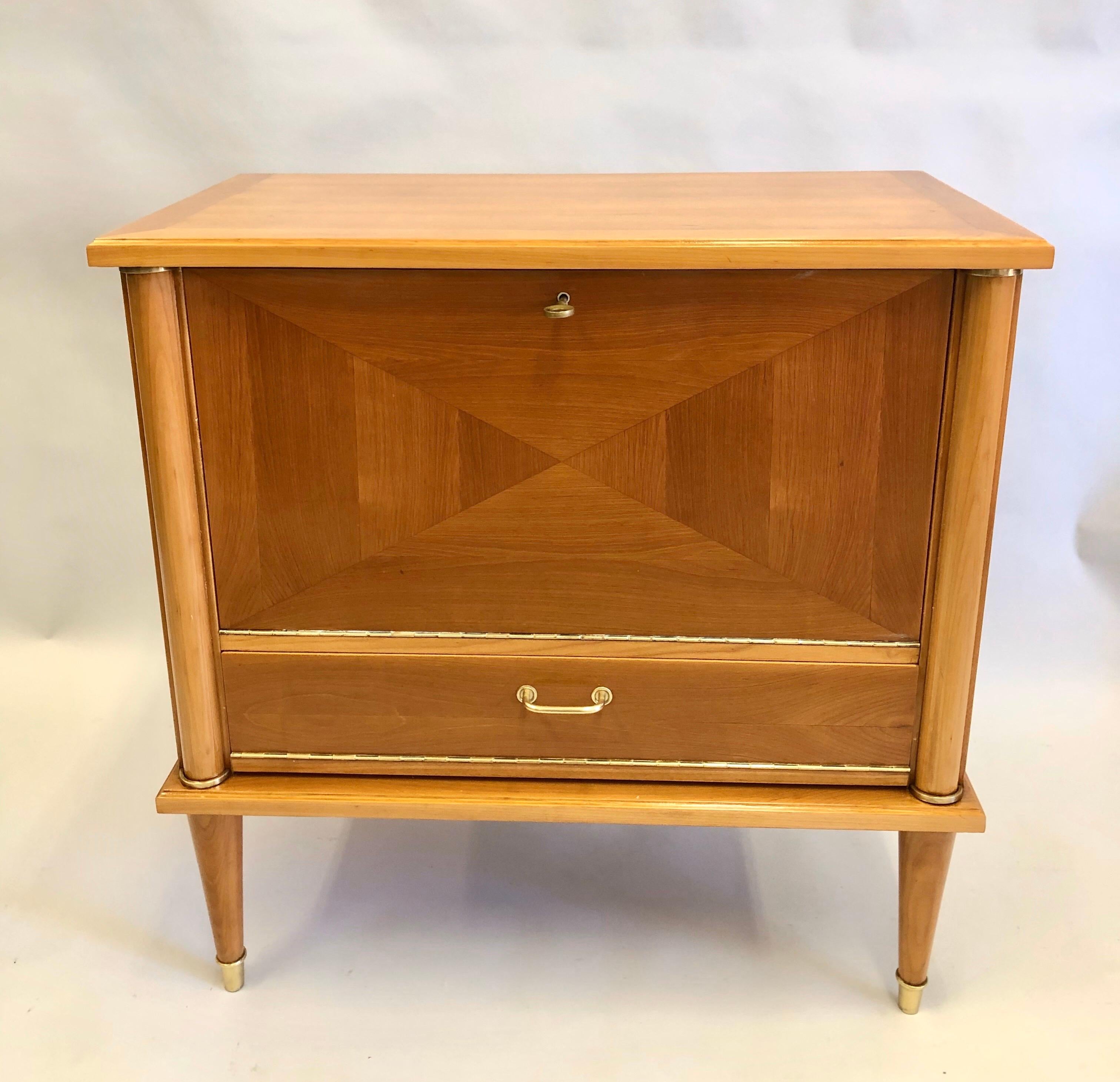 Elegant French modern neoclassical inlaid cherrywood sideboard / buffet / console / bar / cabinet by Andre Arbus with solid brass details. 

The piece resembles a work of architecture, a small neoclassical building flanked by sober columns and