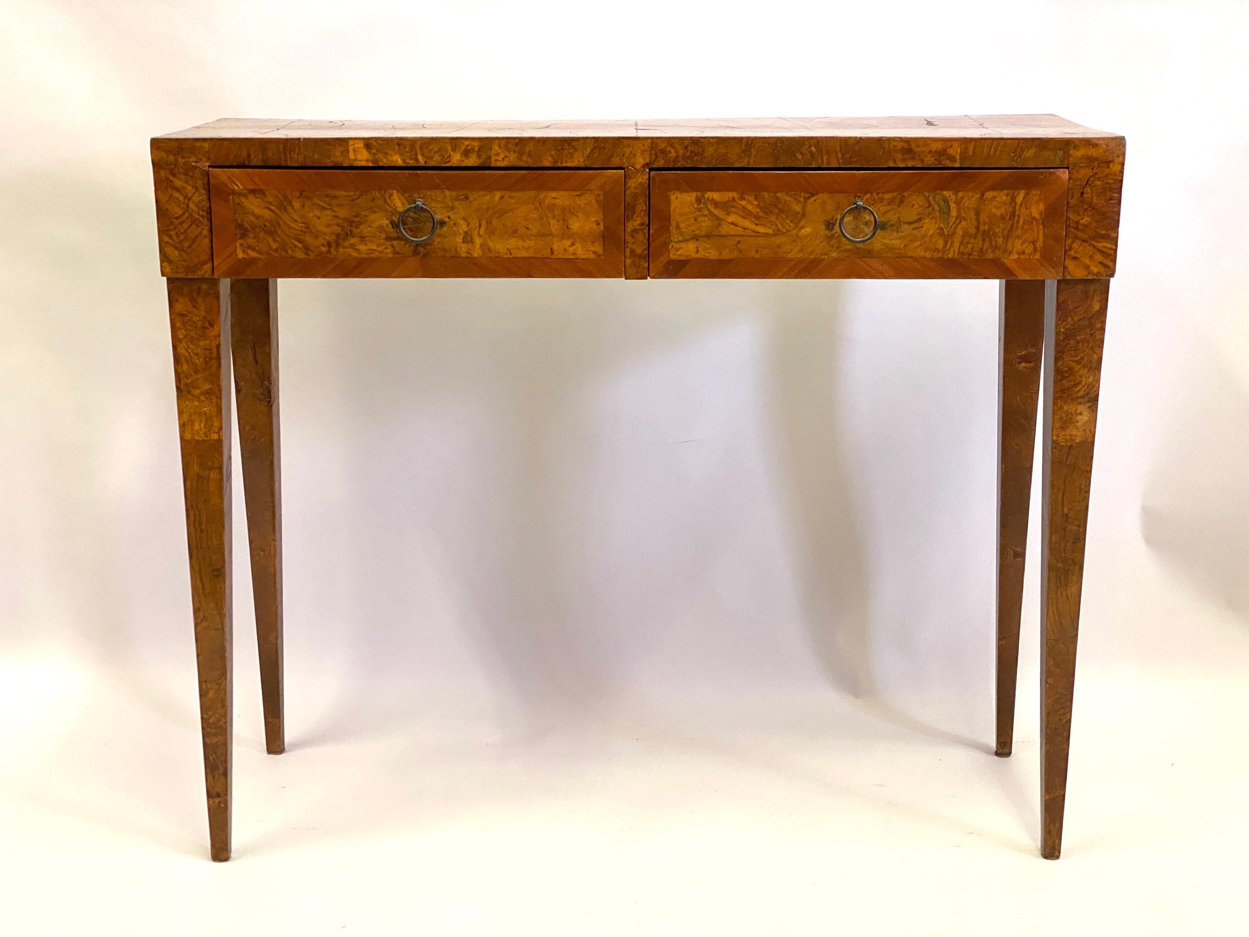 Elegant French Mid-Century Modern neoclassical console or desk or vanity from the circle of Jean-Michel Frank.

The piece is composed of fruitwood with sober lines, elegantly tapered legs and 2 drawers with bronze ring pulls. It is finished on 3