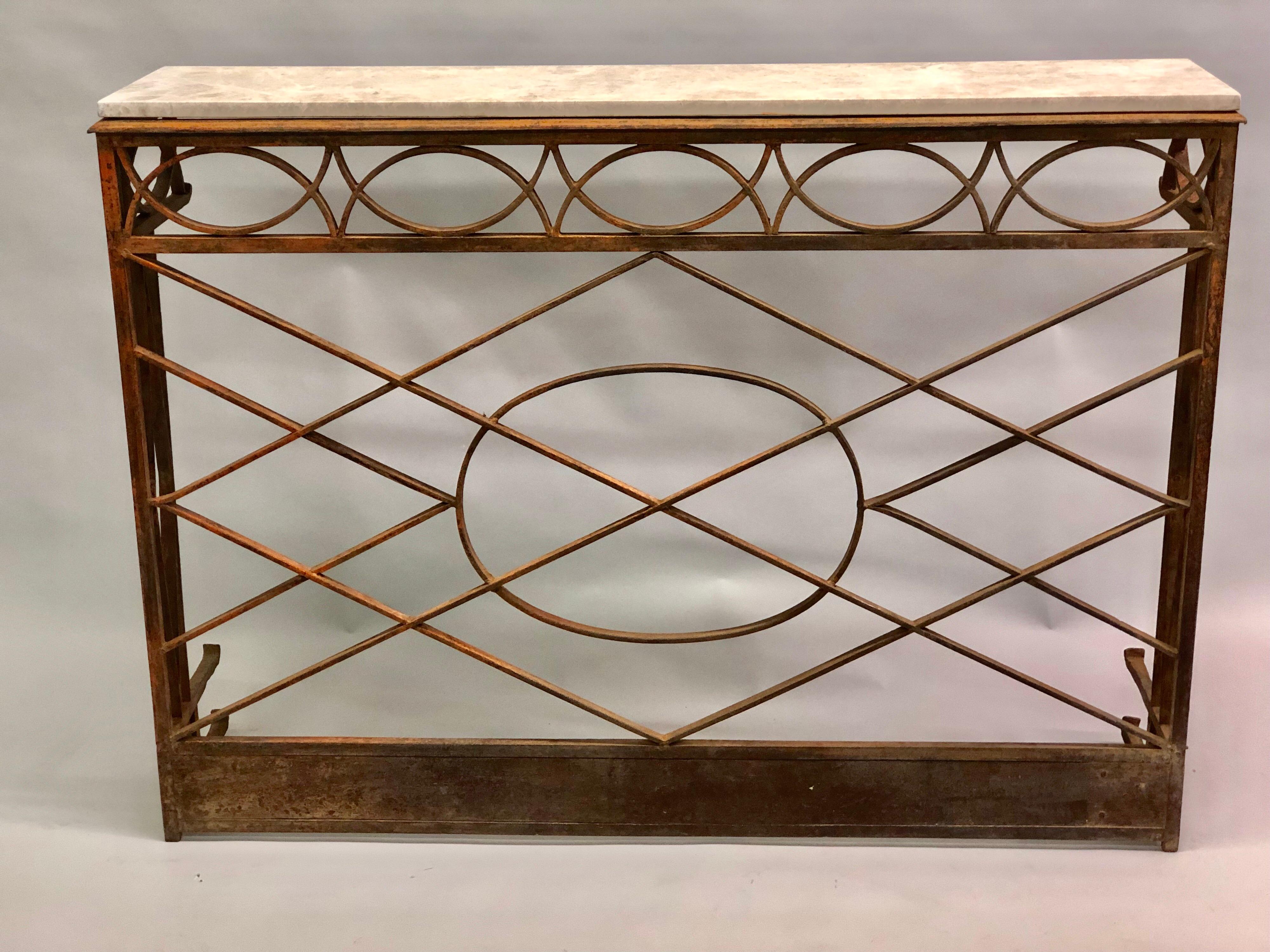 Elegant, Timeless French Modern neoclassical cast and wrought iron console with limestone top, circa 1860-1880.

The console is designed with intersecting lozenge patterns united by central circle. Much of its original paint remain, mixed with