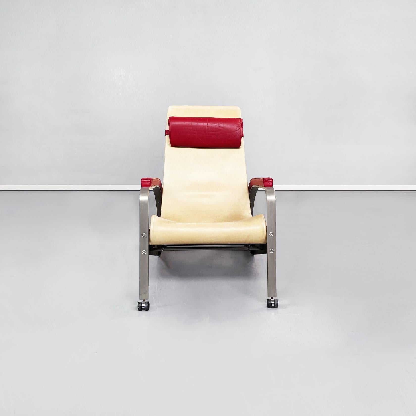French modern reclining leather and steel armchairs by Jean Prouvé for Tecta, 1980s
Pair of reclining armchairs with seat and back upholstered in beige leather. There is a rectangular cushion padded and upholstered in red leather, tied to the