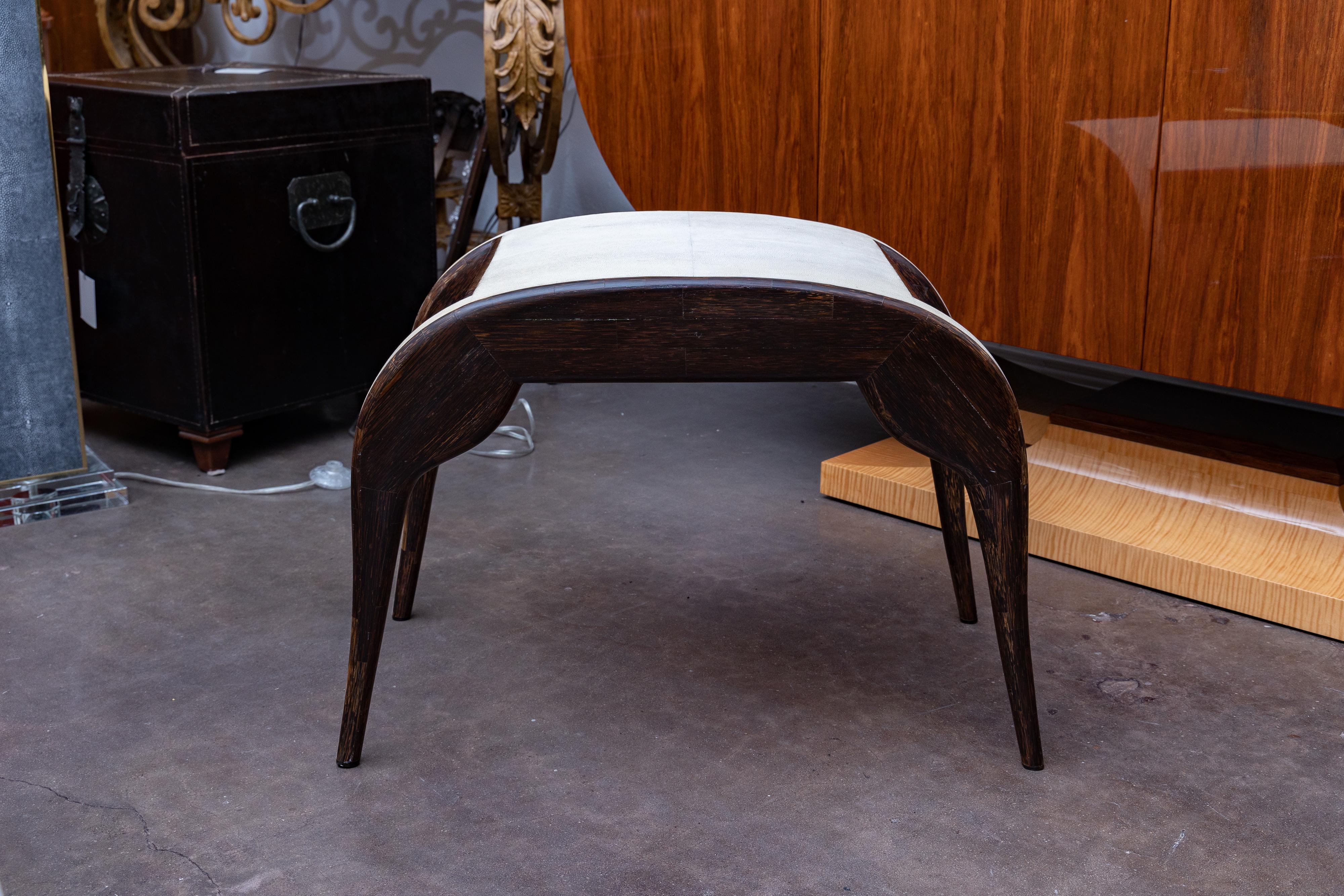 This is a Classic French midcentury rosewood bench by R&Y Agousti, with Shagreen upholstery.