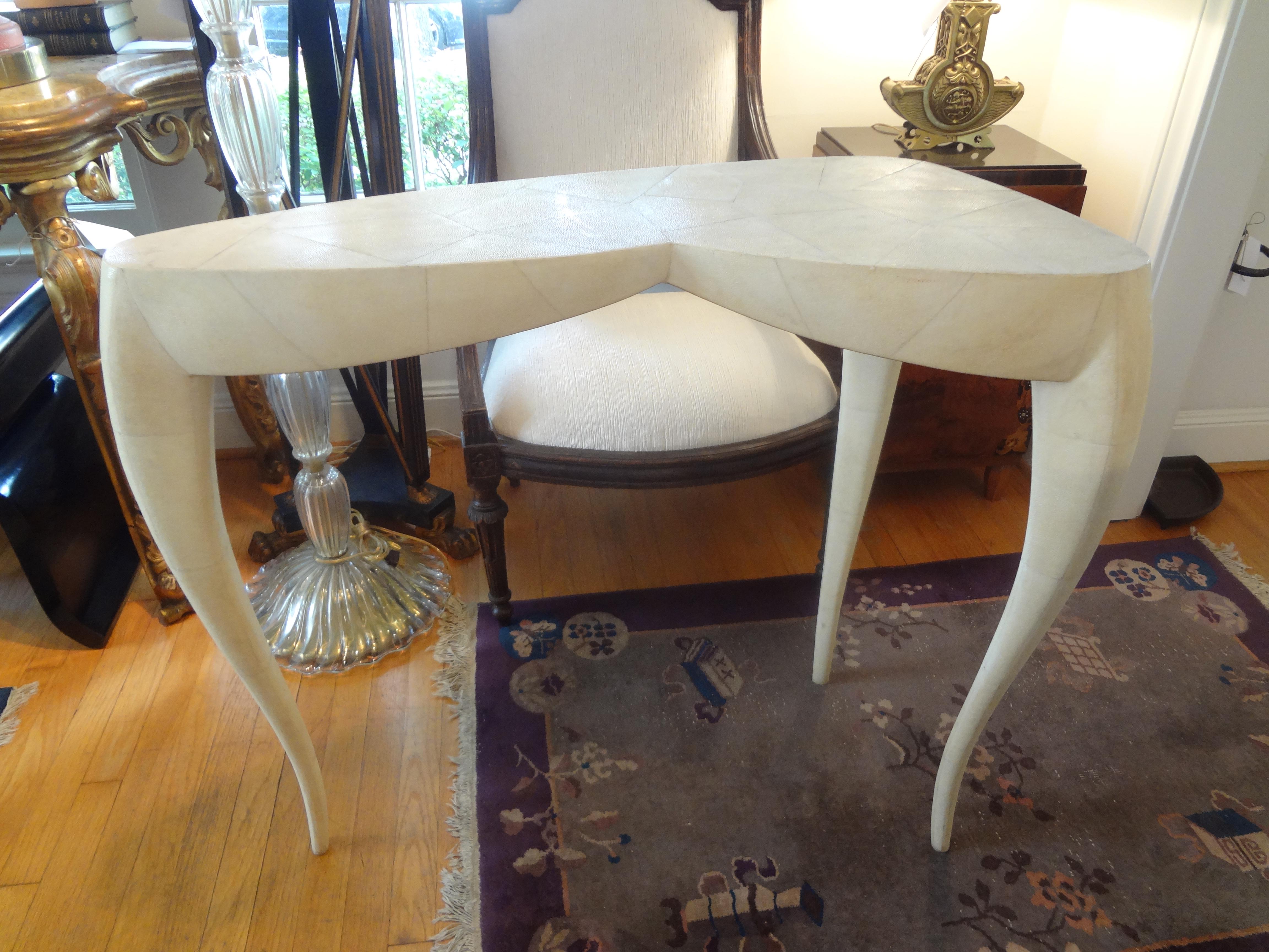 Organically shaped French modern shagreen console table by R&Y Augousti, Paris. This stunning and rare free standing console is made of wood covered in shagreen. The top is has an interesting patchwork pattern.