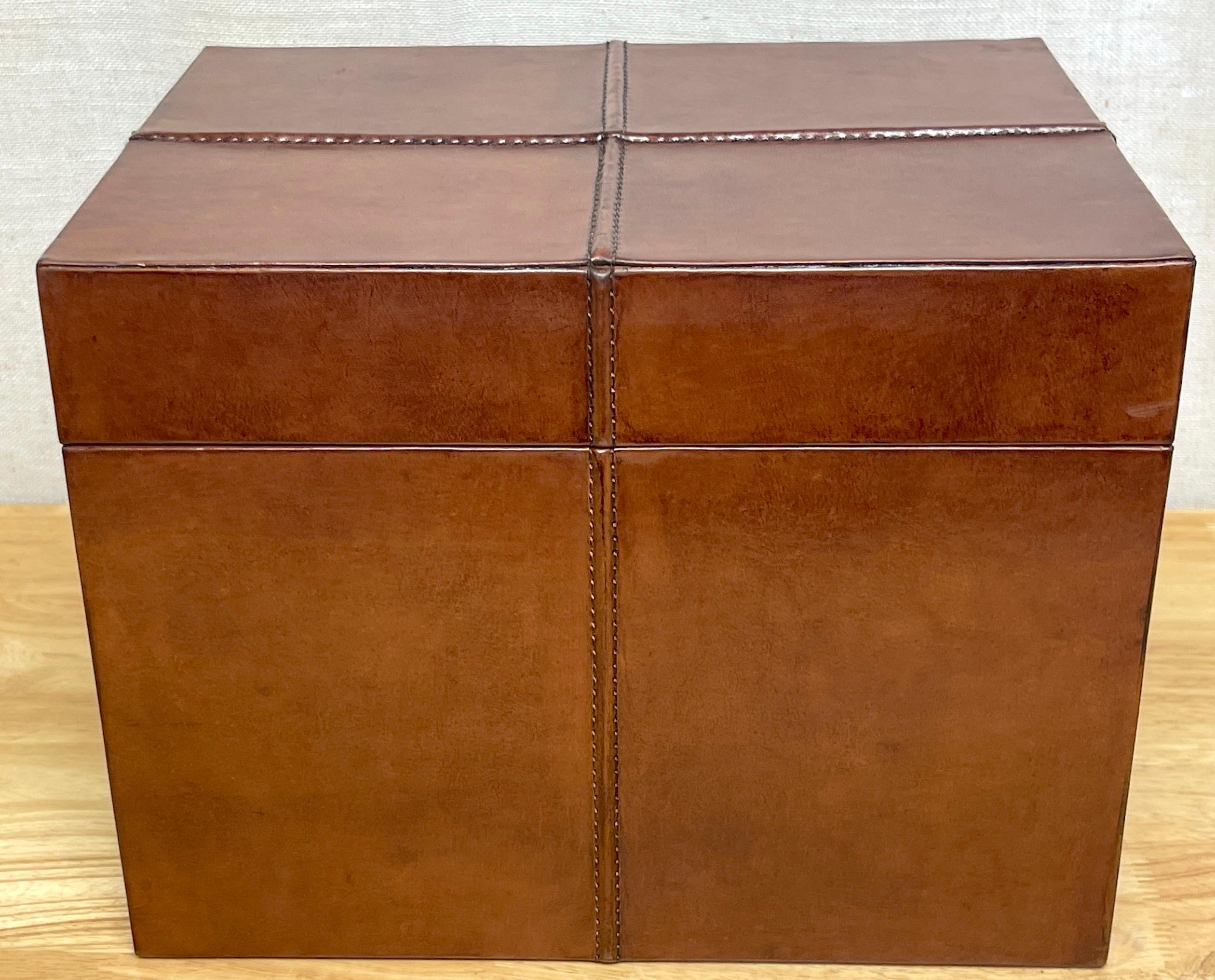 French Modern Stitched leather Rectangular table box 
France, later 20th century 
French modern leather table box, reminiscent of Jacques Adnet works. This stately rectangular box is hand stitched leather, of good size with stitched Quatrefoil