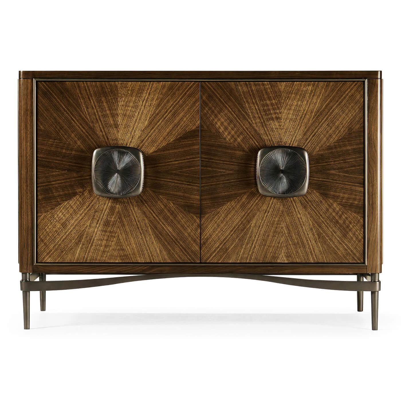 A French modern walnut cabinet. Constructed from walnut with a transparent lacquer finish. The doors feature walnut veneer in a pattern reminiscent of sun rays or straw work. The custom cast hardware is acid dipped and hand-rubbed to achieve a rich,