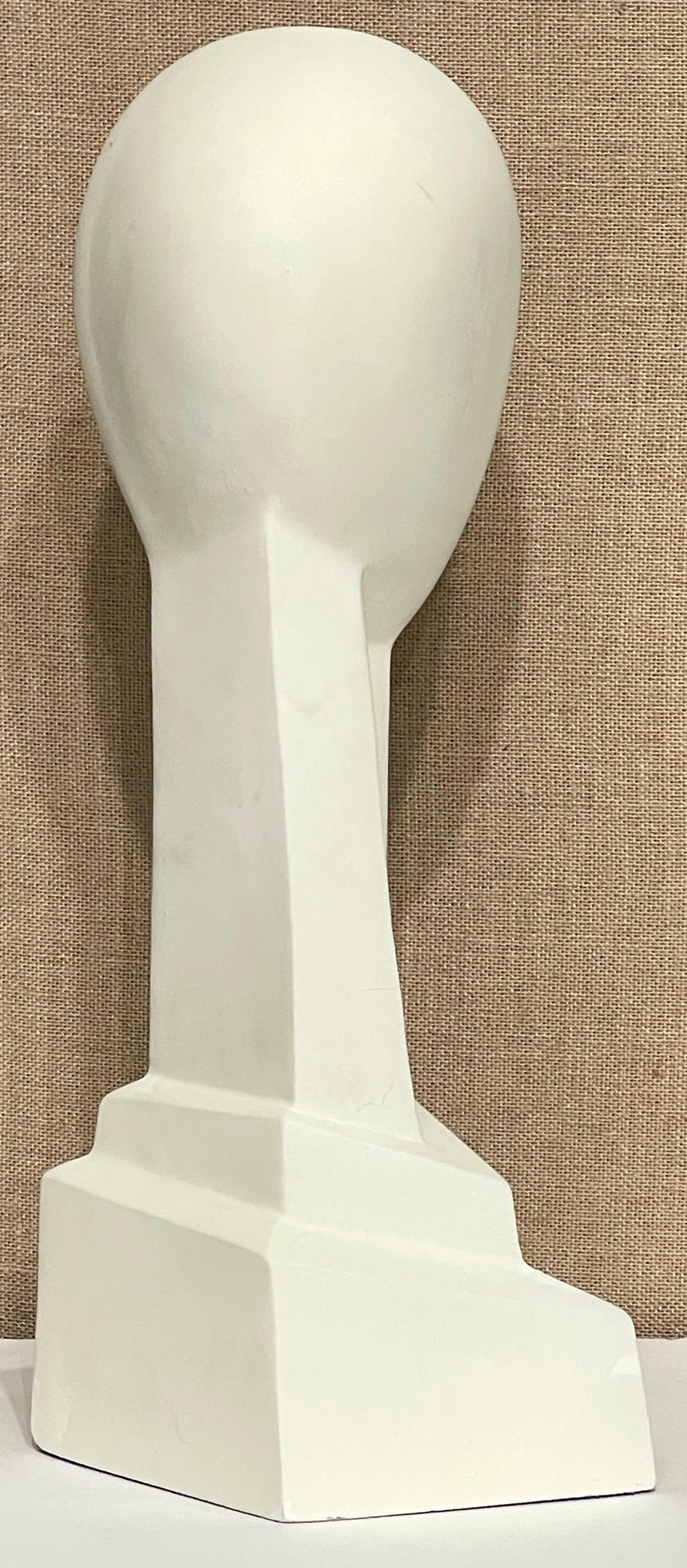 French Modern White Painted Plaster Sculpture 'Head of a Woman,' France, 20th Century, Unsigned

This elegant French Modern School plaster sculpture, titled 'Head of a Woman,' stands as a testament to 20th-century artistry. Though unsigned, the