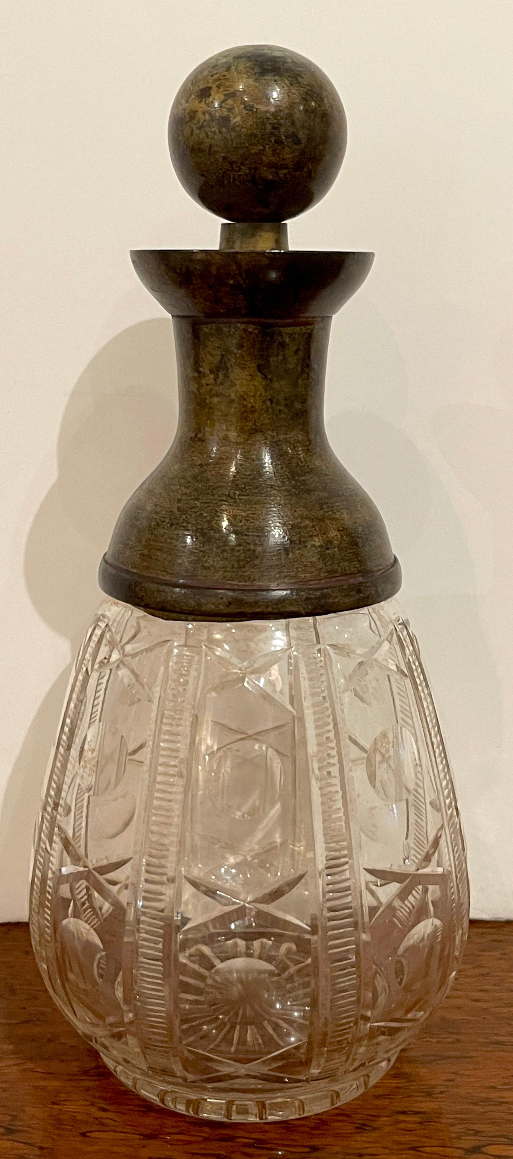 French Modern 'X&O' cut glass & patinated bronze decanter, smaller
With a high caliber (heavy) cast bronze orb stopper, resting on a bronze elongated conforming bronze collar the lower part with rows of cut glass 'X & 0' s
This decanter stands