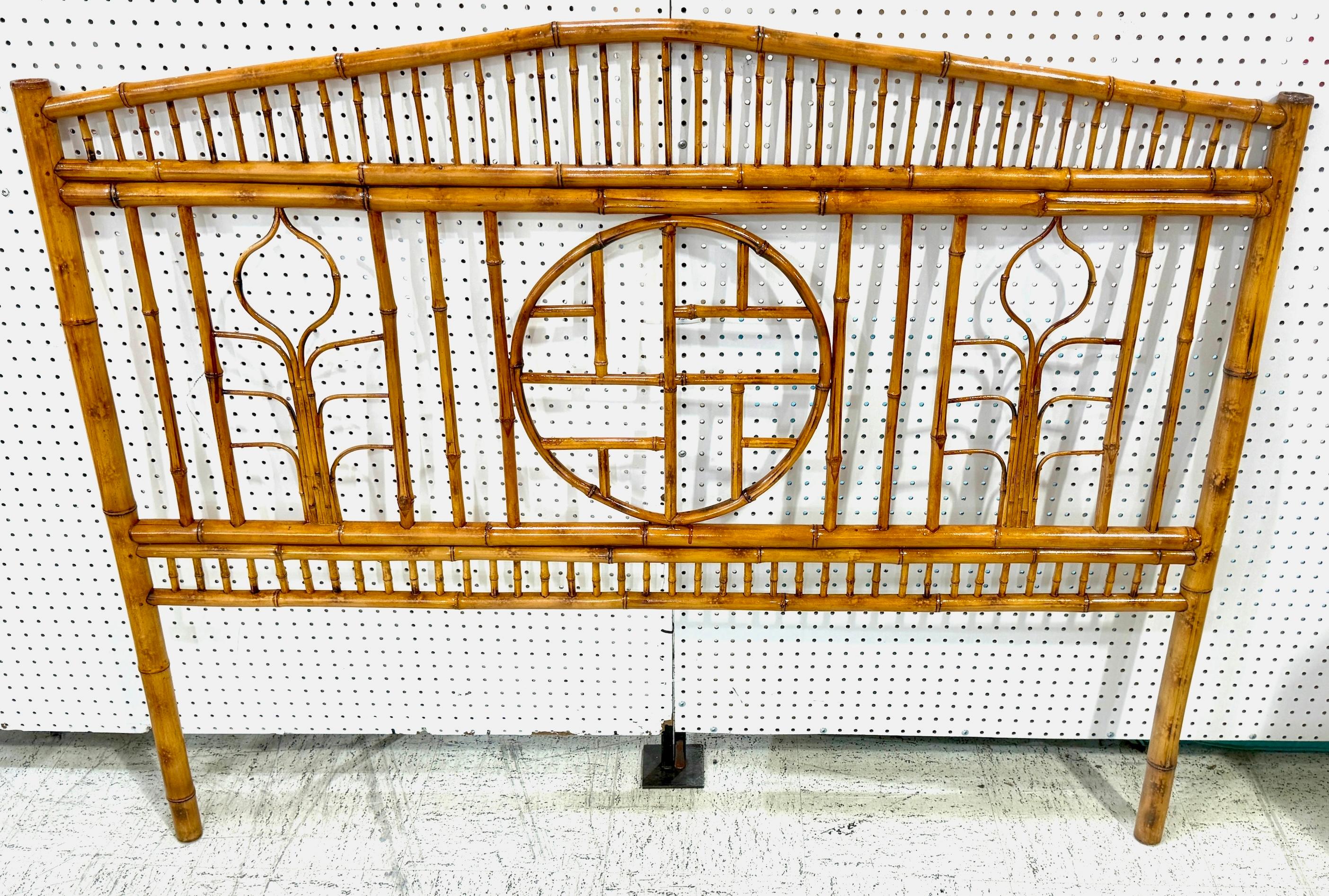 French Modern Zen Motif Bamboo and Rattan Queen Size Headboard, 
Circa 1970s

A beautiful French Modern Zen Motif Bamboo and Rattan Queen-Size Headboard, circa 1970s. This elegant piece features a slight pagoda top, standing 47 inches high at its