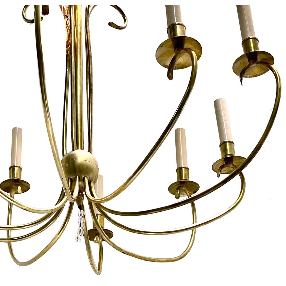 A circa 1960's French polished bronze ten-arm chandelier.

Measurements:
Diameter: 27?
Drop: 33?.