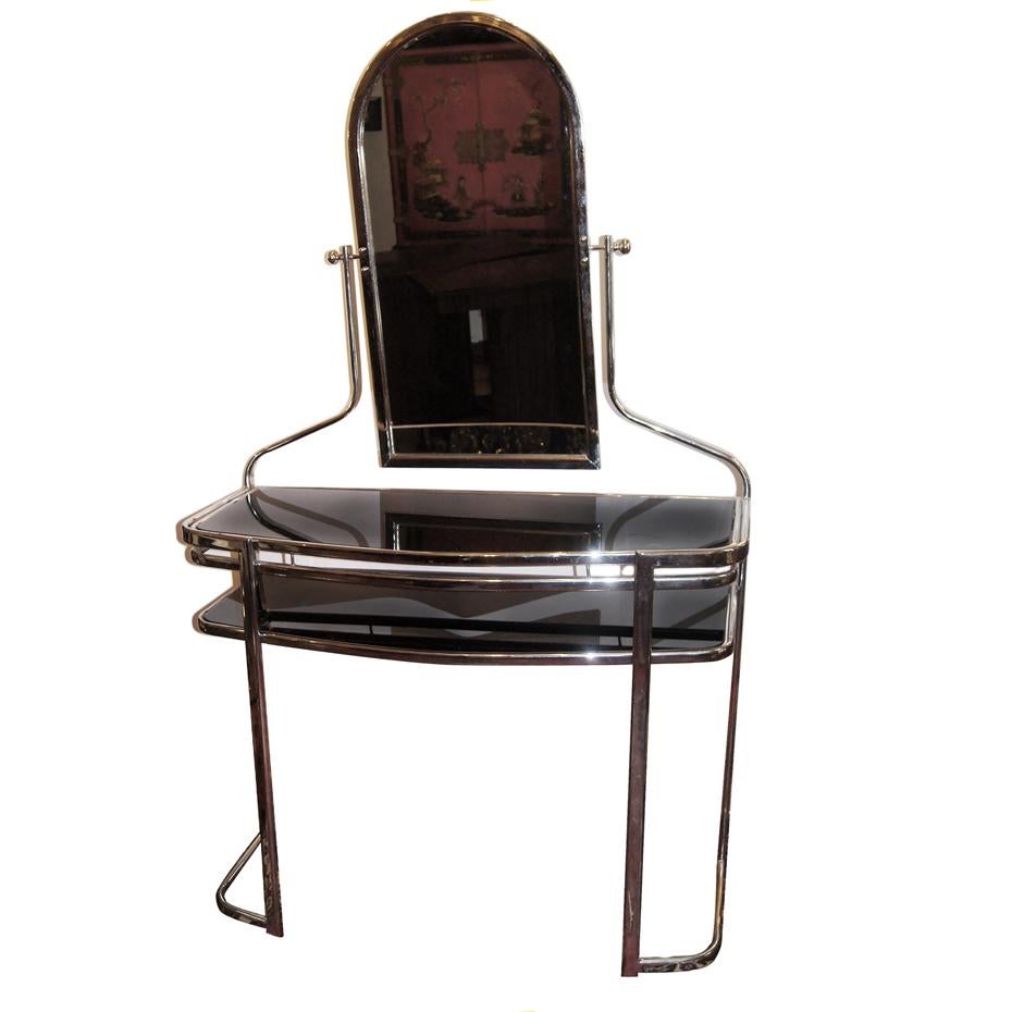 A French circa 1950s nickel-plated vanity with black glass shelves and mirror.

Measurements:
Height 64 3/4