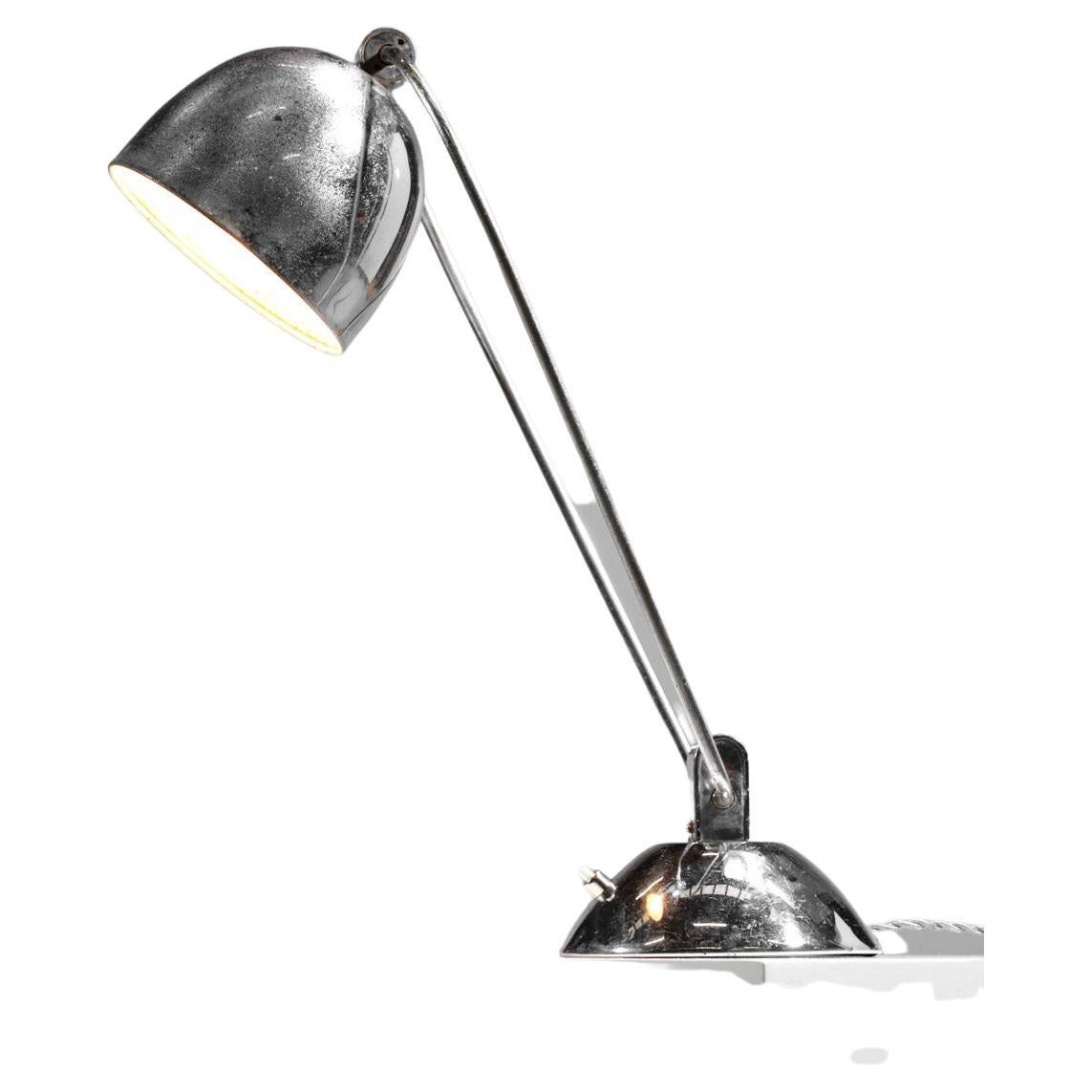 Modernist style desk or accent lamp in the style of Desny's work. All metal chrome plated, please note some pitting on the shade (see pictures). Very nice vintage condition, recommended led bulb type B22.