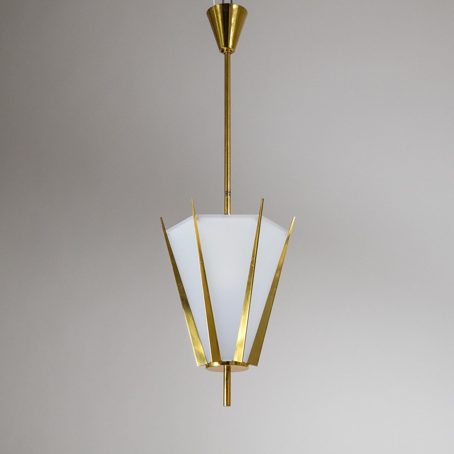 Fabulous French midcentury brass pendant or lantern, circa 1960. Hexagonal crown-like structure in brass with opaque acrylic diffuser panels. This is an extremely well designed and constructed piece with precision-tooled custom elements. Very good