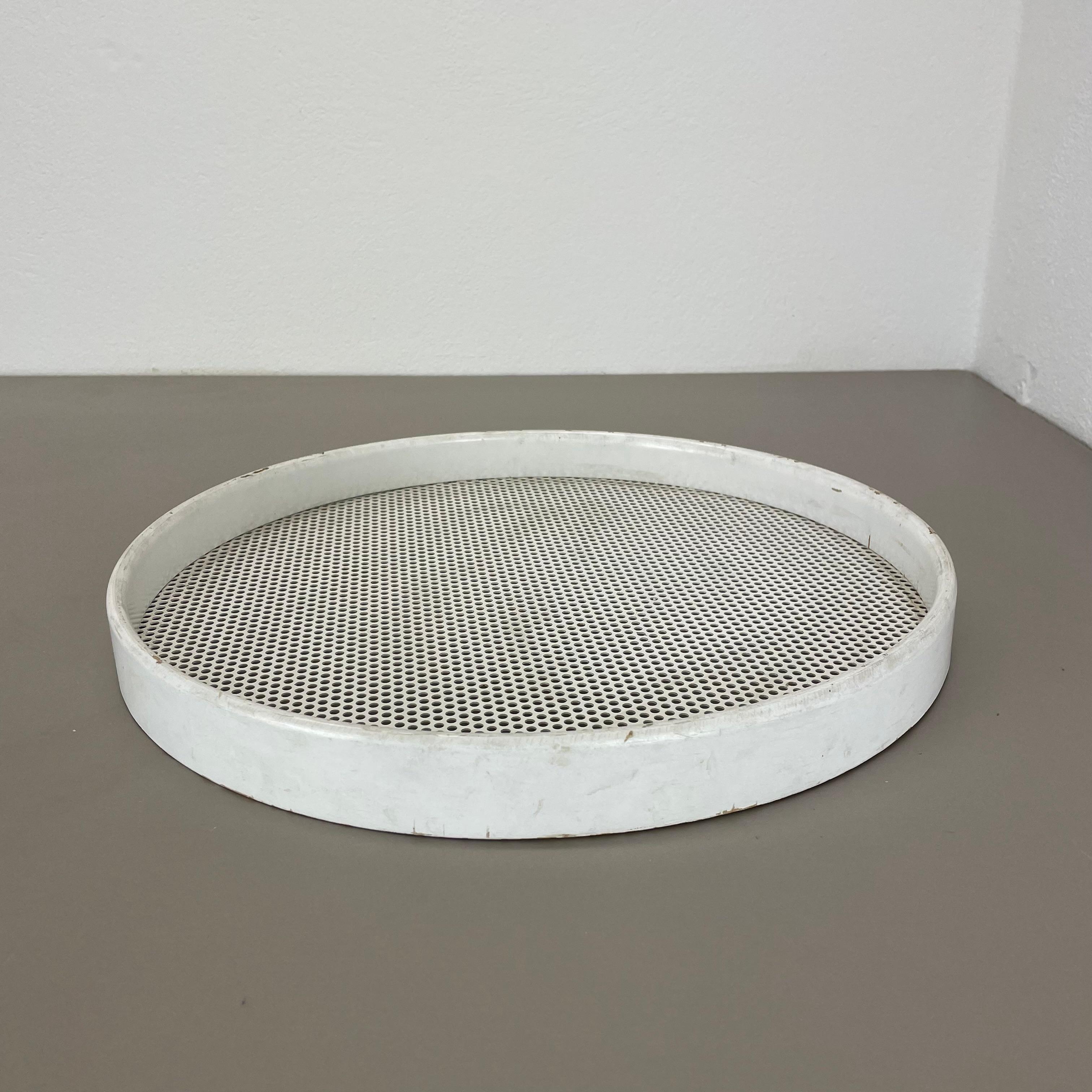 Metal tray.

In style of Mathieu Matégot.

Origin: France,

1970s.

This original vintage tray element was produced in the 1970s in France. It was made of a wooden white lacquered round frame with a middle metal element in hole pattern optic which