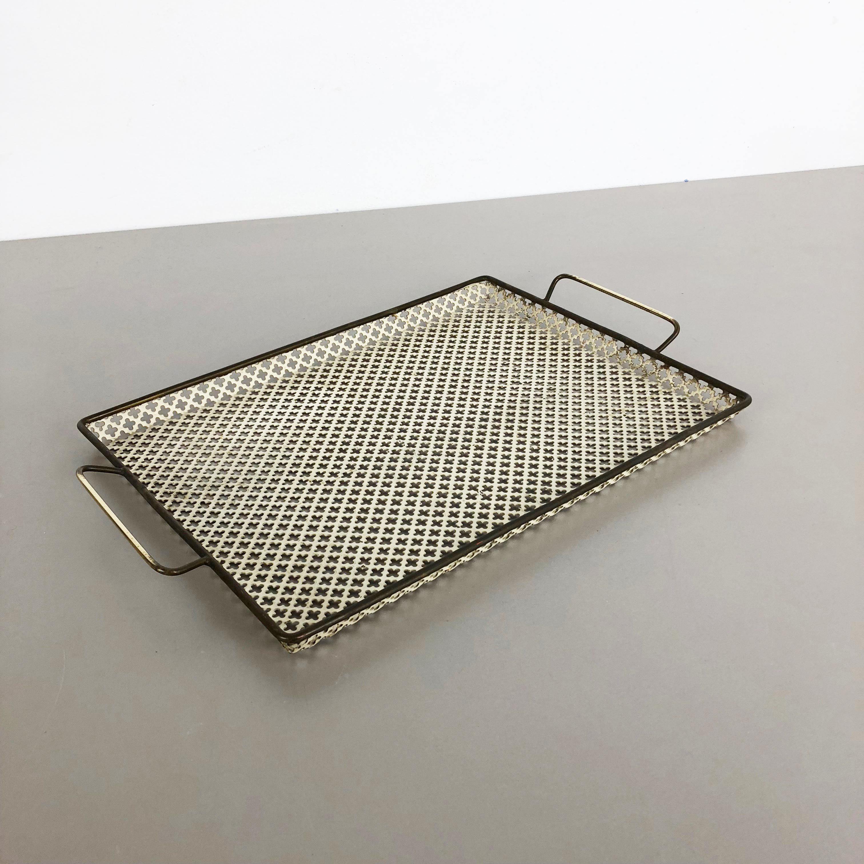 Metal tray.

In style of Mathieu Matégot.

Origin: France,

1950s.

This original vintage tray element was produced in the 1960s in France. It was made of metal in whole pattern optic which is reminiscent with the designs by Mathieu Matégot.