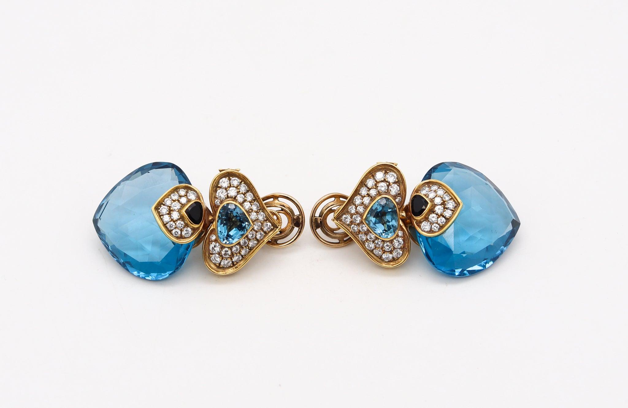 French modernist Clip-on Earrings.

This is a beautiful colorful pair of clips-on earrings, created in Paris France by the same jewelry maker of Marina B. The pair of clips earrings has been crafted as dangle drops, in solid yellow gold of 18 karats