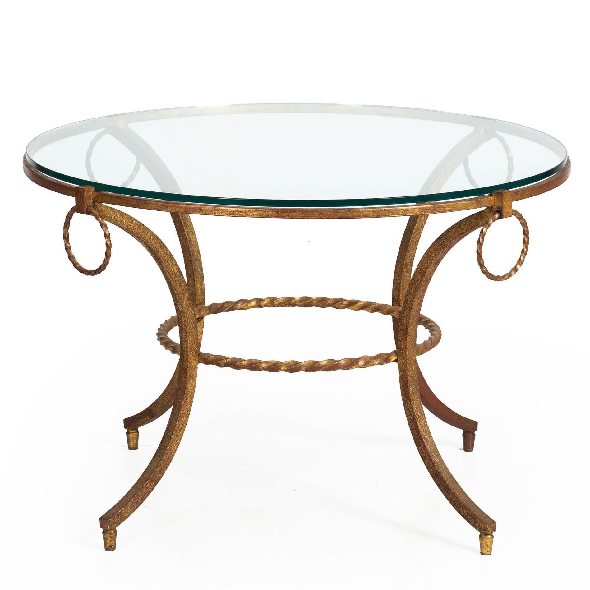 MODERNIST GILDED WROUGHT-IRON AND GLASS COFFEE TABLE
French, circa 1950s  unmarked
Item # 401RGG02P-1

An endlessly interesting modernist accent table from the 1950s, it works perfectly both as a side table beside a low sofa or chair or as a coffee