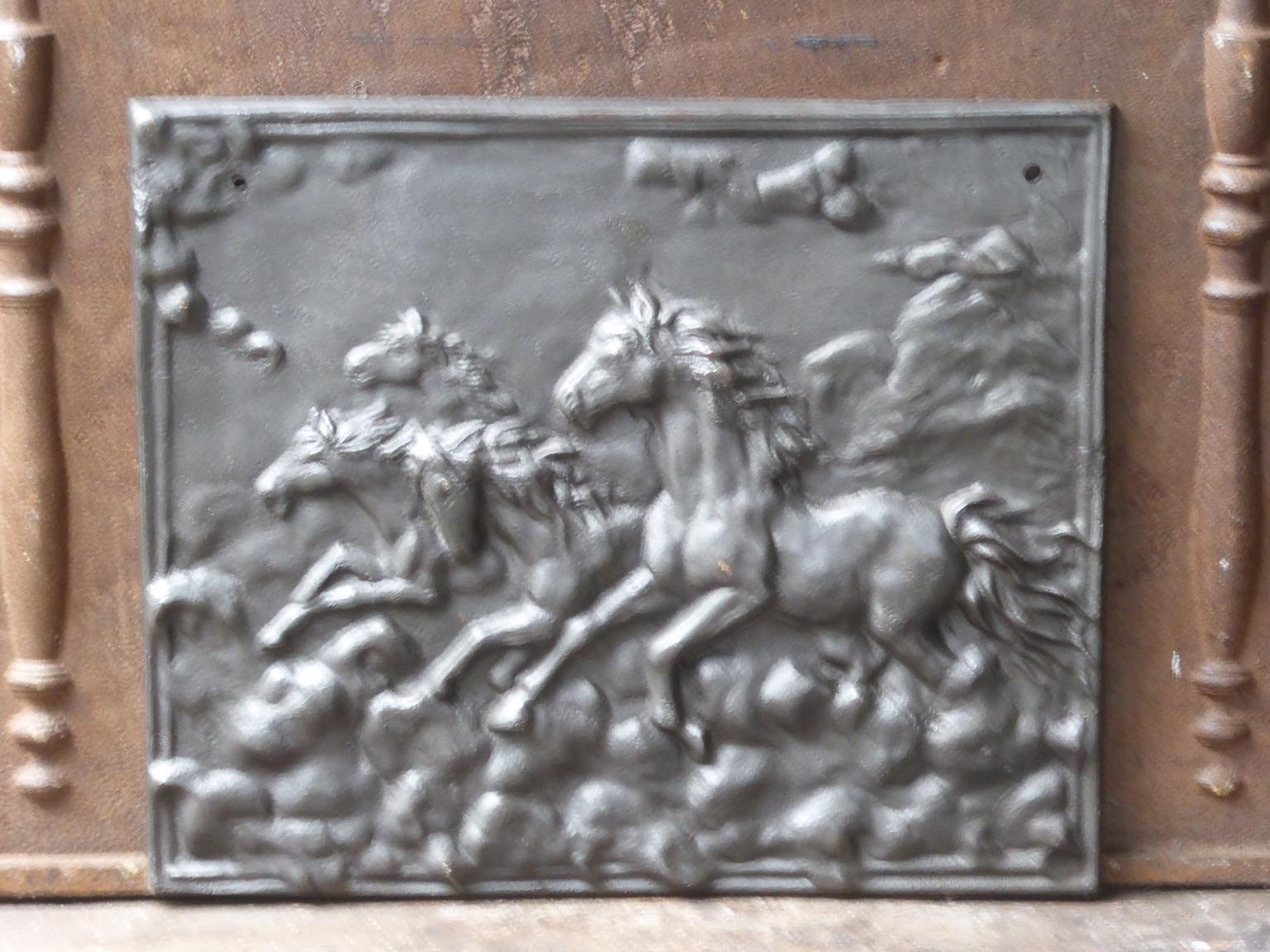 20th century French fireback with horses. The fireback is made of cast iron. The patina is black / pewter.