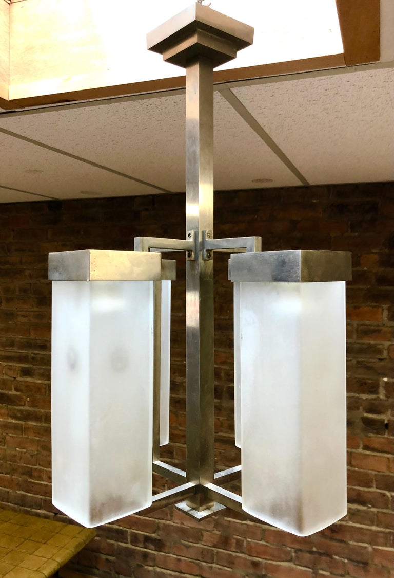 c. 1930, in the style of Jean Boris Lacroix, top level construction with heavy gauge solid brushed nickel bronze supports and heavy cast glass shades, from the estate of Alan Moss.