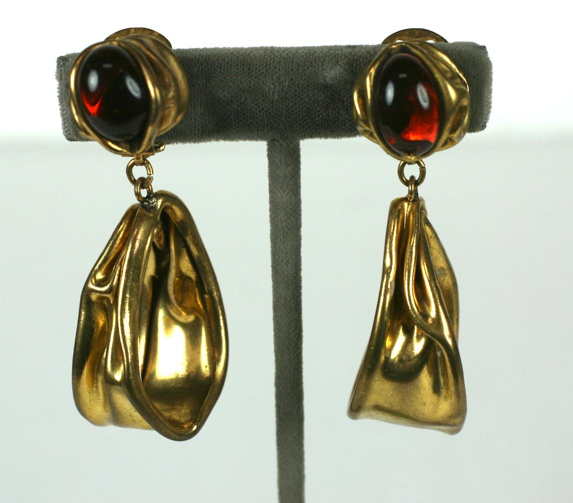 Large and striking French Modern brutalist style oval hoop ear clips by Serge Breton. Deep topaz pate de verre cabochons set into antique gold finished brutalist crushed metal. 
Excellent Condition, Made in France, Signed S Breton. Clip back