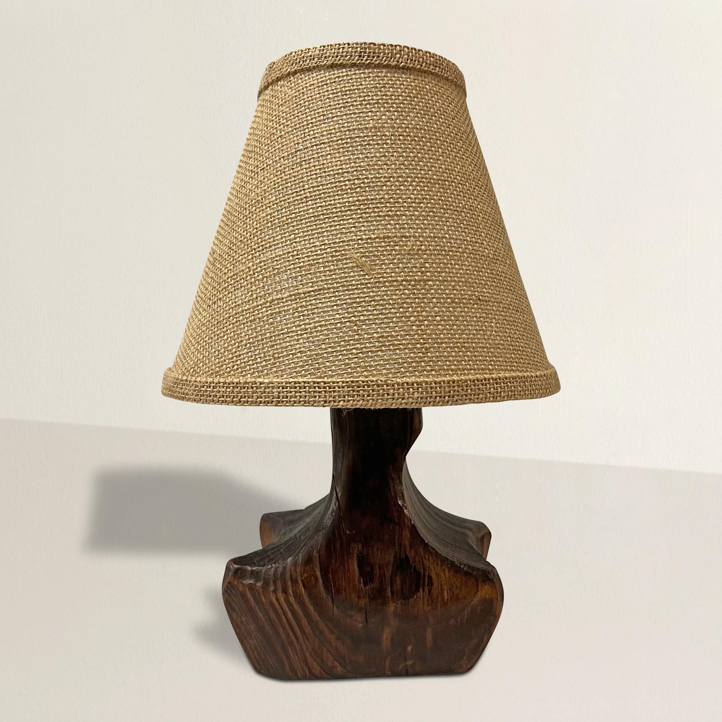 A chic and handsome early 20th century French Modernist wood lamp of organic shape, and with a custom-made burlap shade, newly wired for U.S. with a gold twist silk cord.  The perfect size for your powder room, bedroom, or entry table.