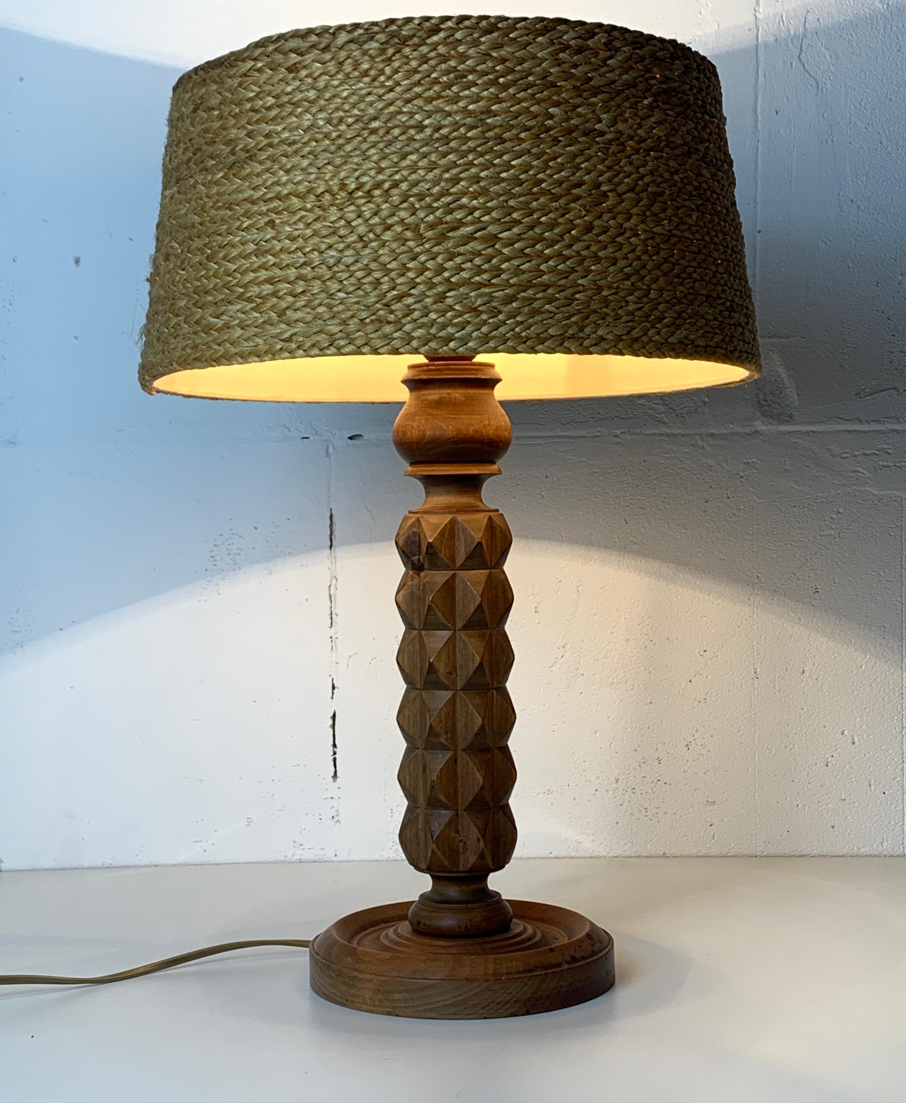A gorgeous French modernist table lamp with vintage rope lampshade ( later addition ), ca 1940s-1950s. These lamps are often named in the style of Charles Dudouyt . The wood is in a lovely patinated condition as can be seen in the pics and the lamp