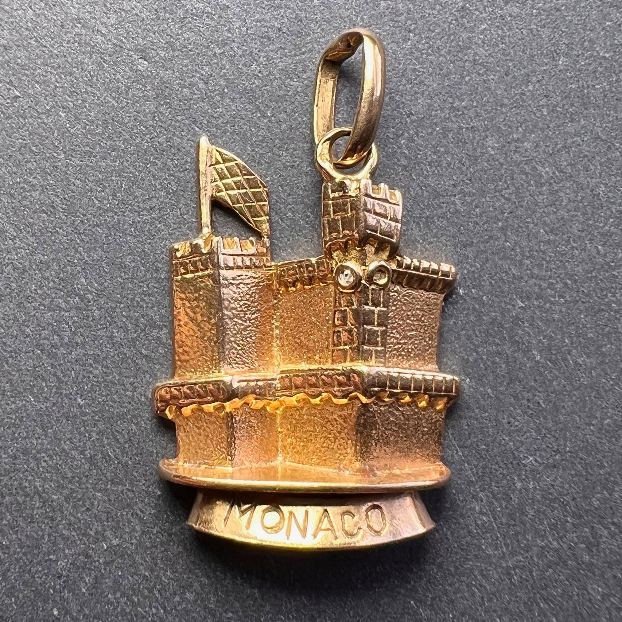An 18 karat (18K) yellow gold charm pendant designed as a castle engraved Monaco. Stamped with the eagle mark for 18 karat gold and French manufacture.
 
Dimensions: 2 x 1.5 x 0.45 cm (not including jump ring)
Weight: 3.25 grams 
(Chain not