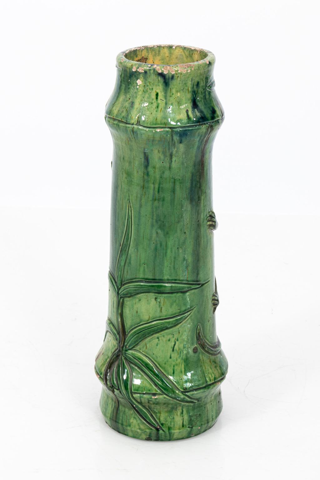 Green painted French monkey and tree umbrella stand, circa 1920s. Please note of wear to the paint and minor losses to the ceramic due to age and daily use.
