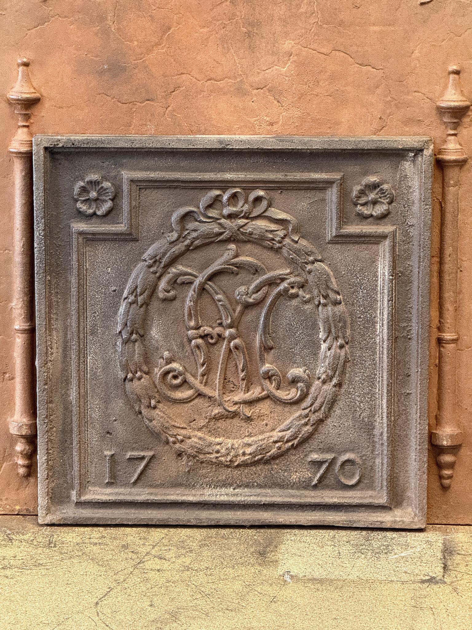 18th century French Louis XV Period fireback. The date of production, 1770, is cast in the fireback. 

The fireback is made of cast iron and has a natural brown patina. Upon request, it can be made black/pewter. The condition is good; there are no