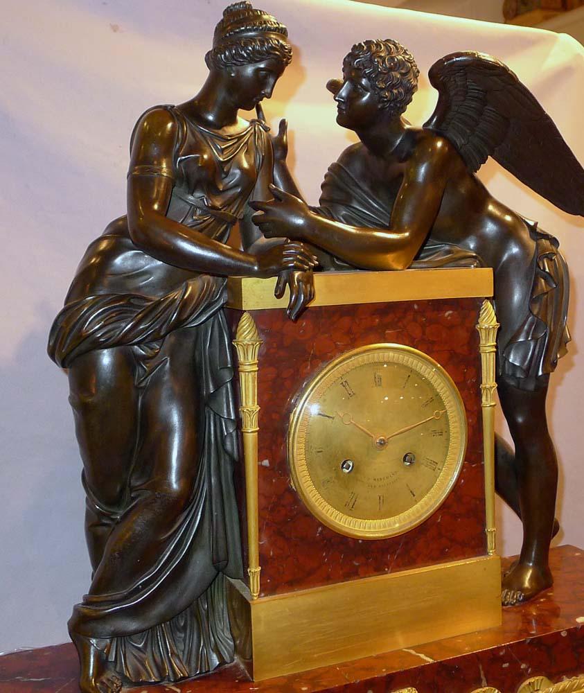 Magnificent monumental version of the iconic clock depicting Psyche and Cupid. This verson dating from circa 1820-1830 is by JB Marchand a re-knowned bronzier and it differs from the more common Claud Michalon version. The Michalon clock has Cupid