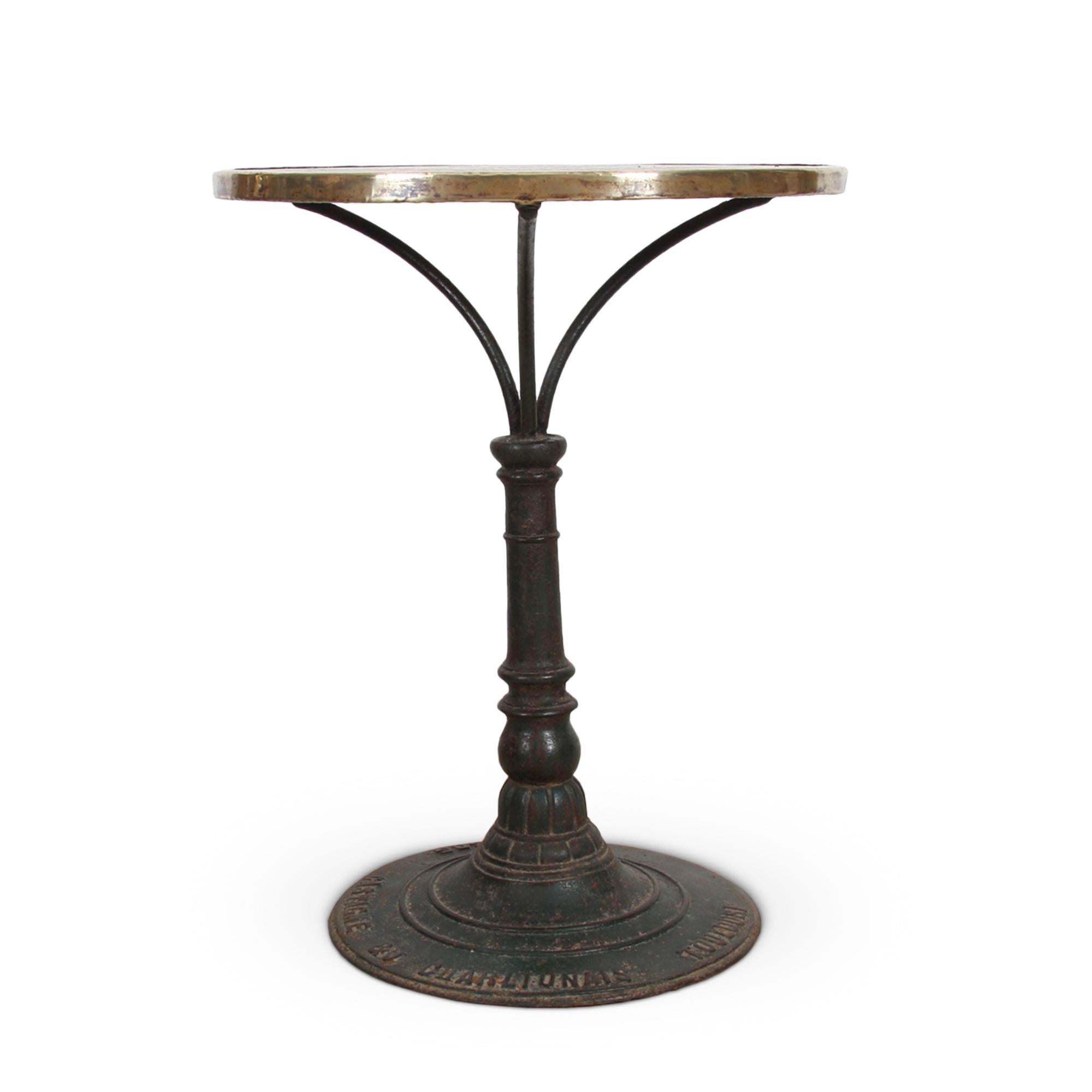This magnificent mosaic top table, with brass detail and a wrought iron base, dates back to 1920s France. Pedestal is stamped by the Toulouse maker Castagne & J. Charlionais.