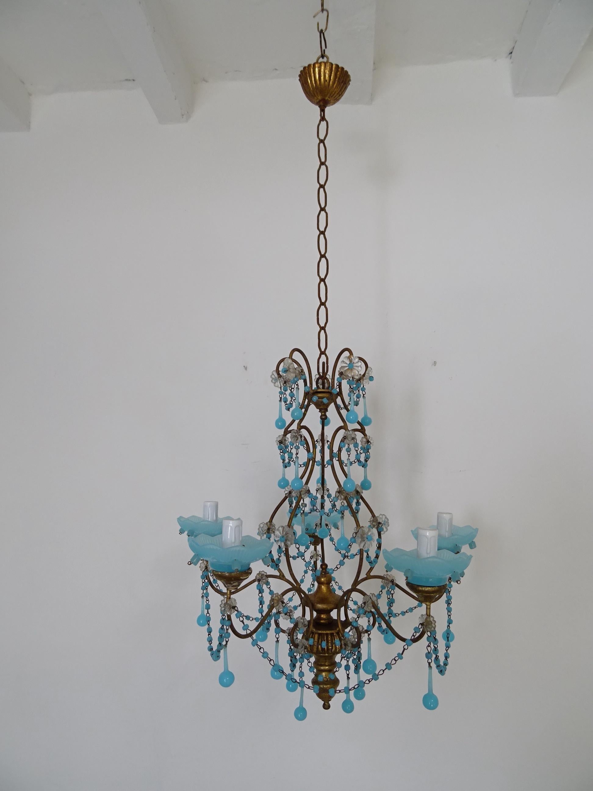 Housing five lights, sitting in blue opaline bobeches with blue opaline beads. Will be wired with certified UL US sockets for the USA and appropriate sockets for all other countries and ready to hang. Giltwood top, centre and posts under the