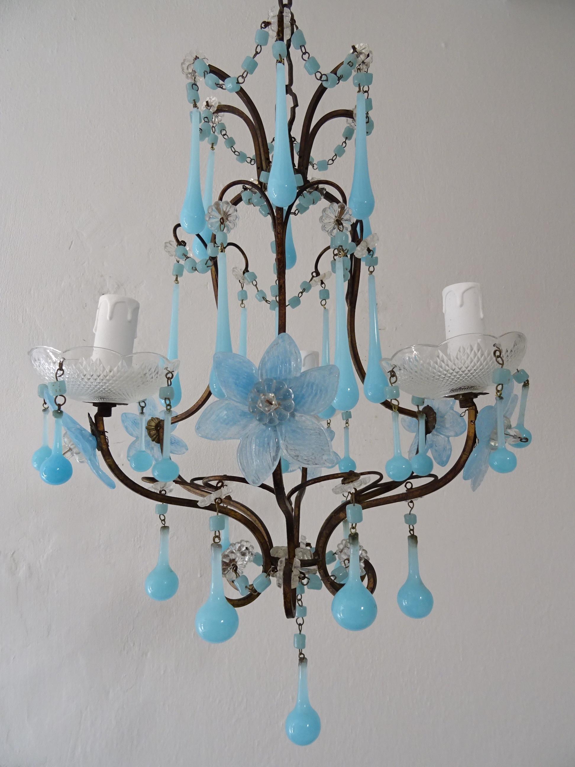 Housing 3 lights, sitting in crystal bobeches with blue Murano opaline beads and small drops. Will be wired with certified UL US sockets for the USA and appropriate sockets for all other countries and ready to hang. Swags of macaroni beads in
