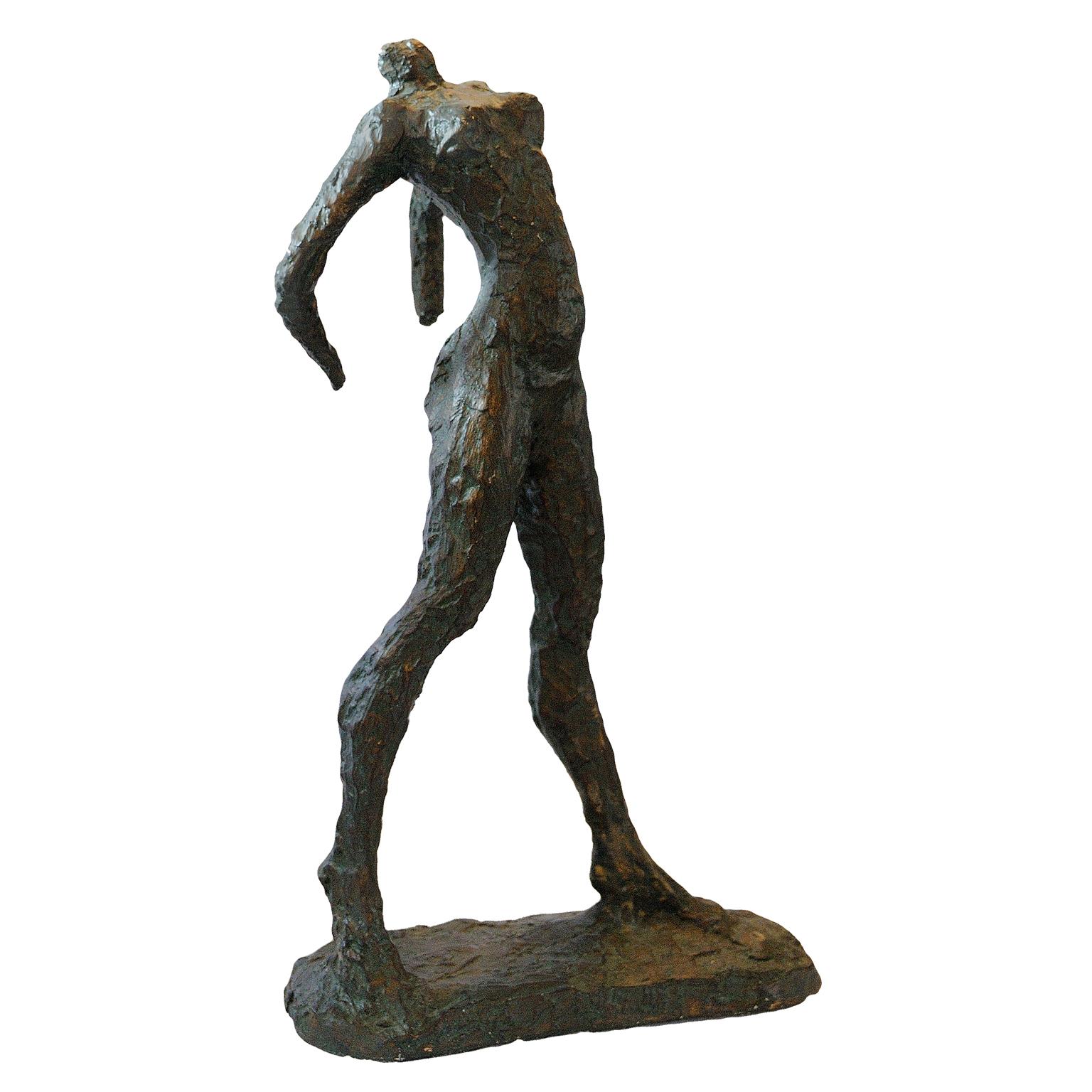 This is a superb French Louvre Museum composition copy of the bronze sculpture 'The Walking Woman' originally by Alberto Giacometti, circa 1970.

During the late 1950s Giacometti made a number of fragmentary figures, their arms partly or entirely
