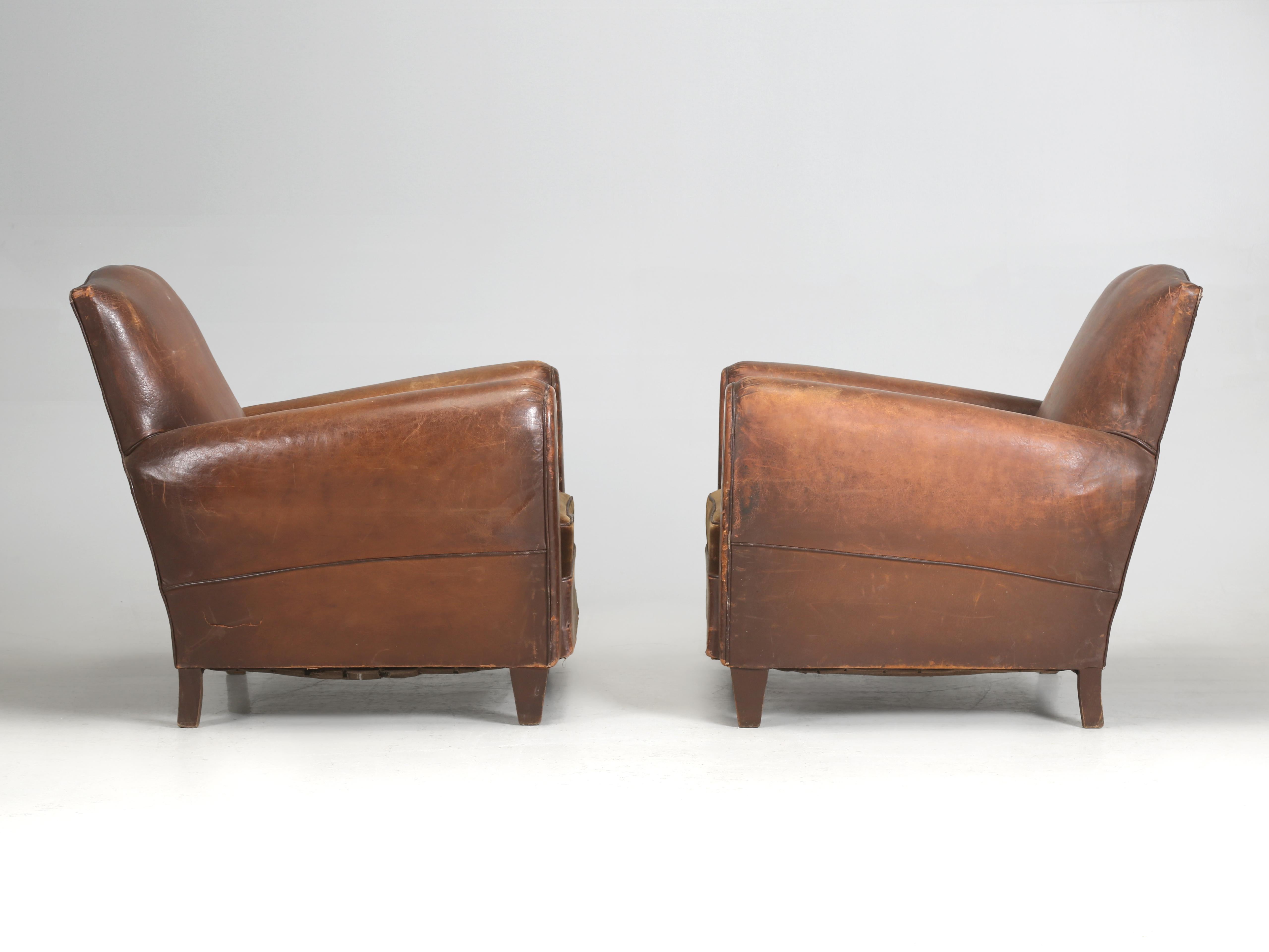French Mustache Style Club Chairs in Original Leather and Completely Unrestored. Not often today that you can still find a pair of Original French Leather Club Chairs in the most desirable Mustache style that some inexperienced upholstered hasn't