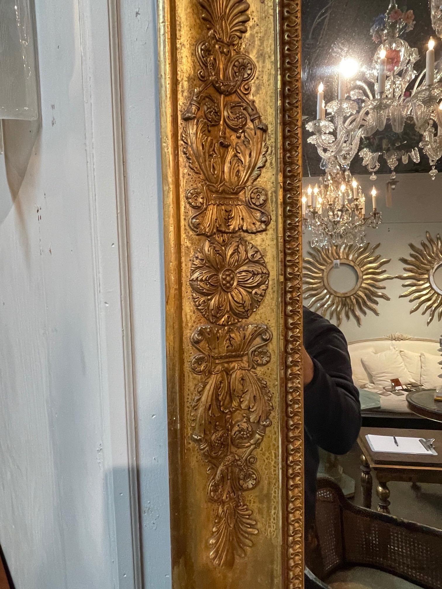 Elegant French Napoleon II giltwood mirror. Lovely floral images and a beaded inner border along with a beautiful gilt make this extra special. Gorgeous!!