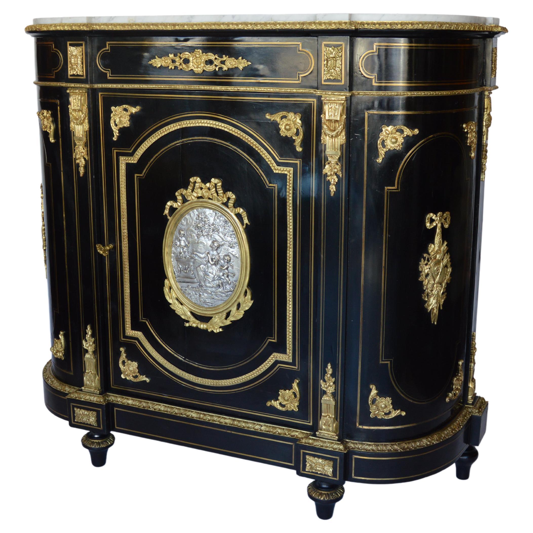 French Napoleon III Sideboard Cabinet in Blackened Wood Decorated with Gilded and Chiseled Bronzes with Silver Medallion and Bronze Plated Details. This Work is Representative of the Napoleon III Period in the 19th Century.