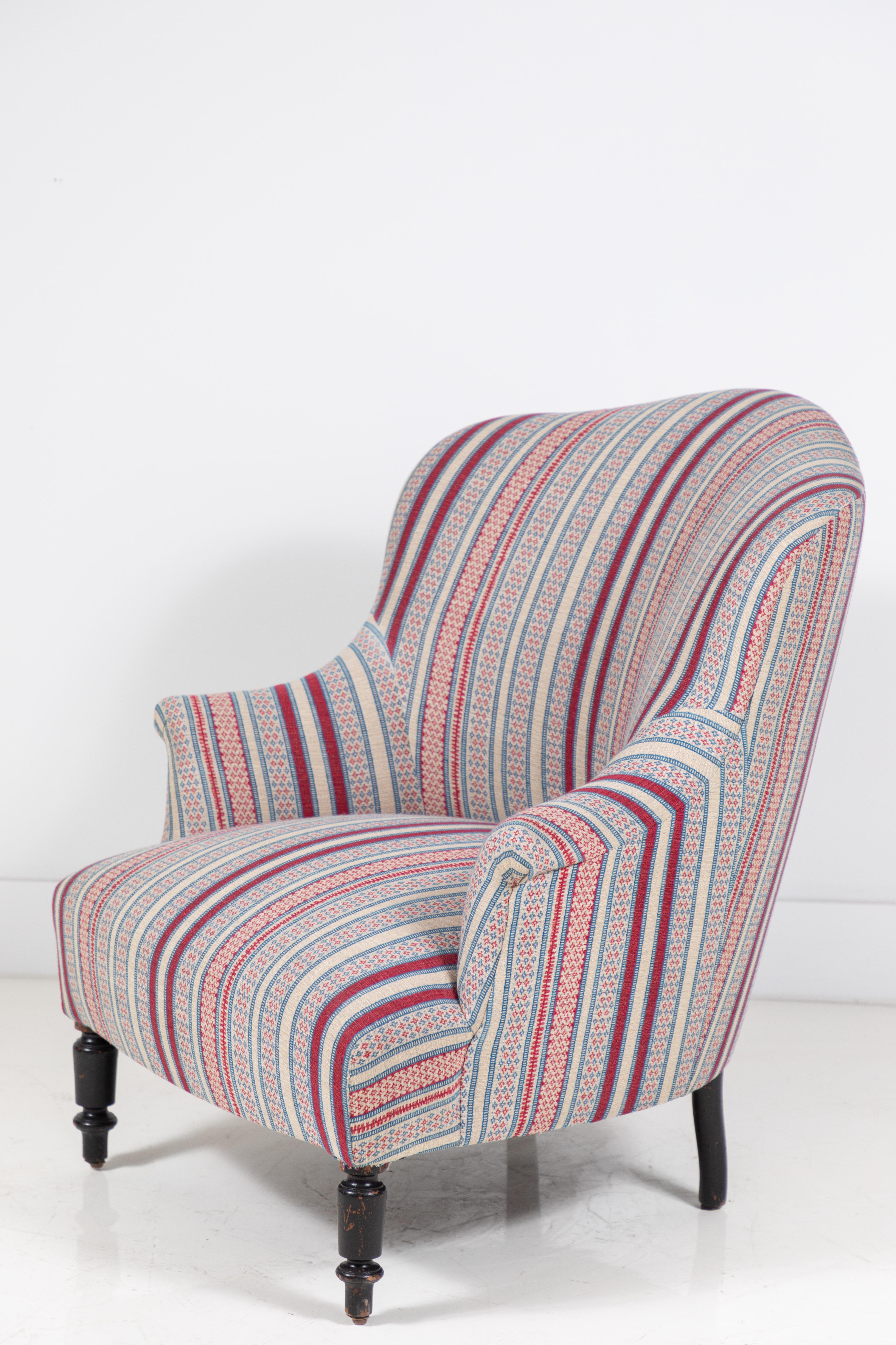 French Napoleon chair newly upholstered in a beautiful woven textile from British textile design, Susan Deliss. The chair offers Classic lines. Feet are original.