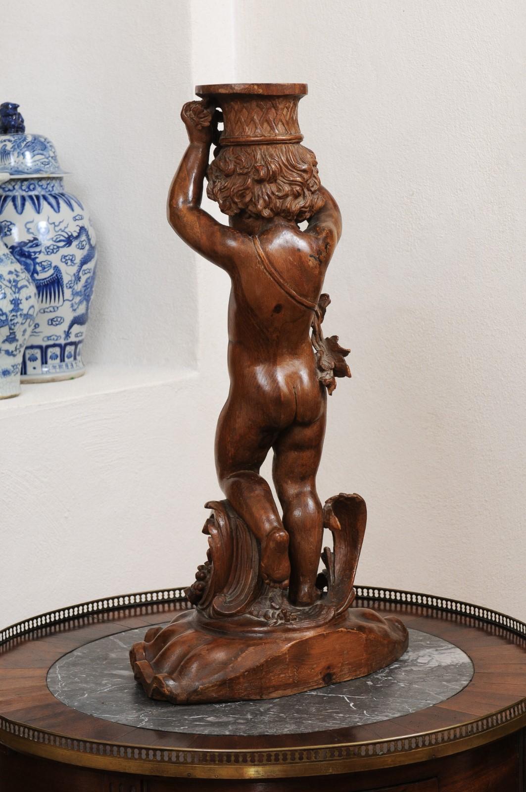 French Napoléon III 1860s Carved Walnut Sculpture of a Putto Carrying a Vessel For Sale 6