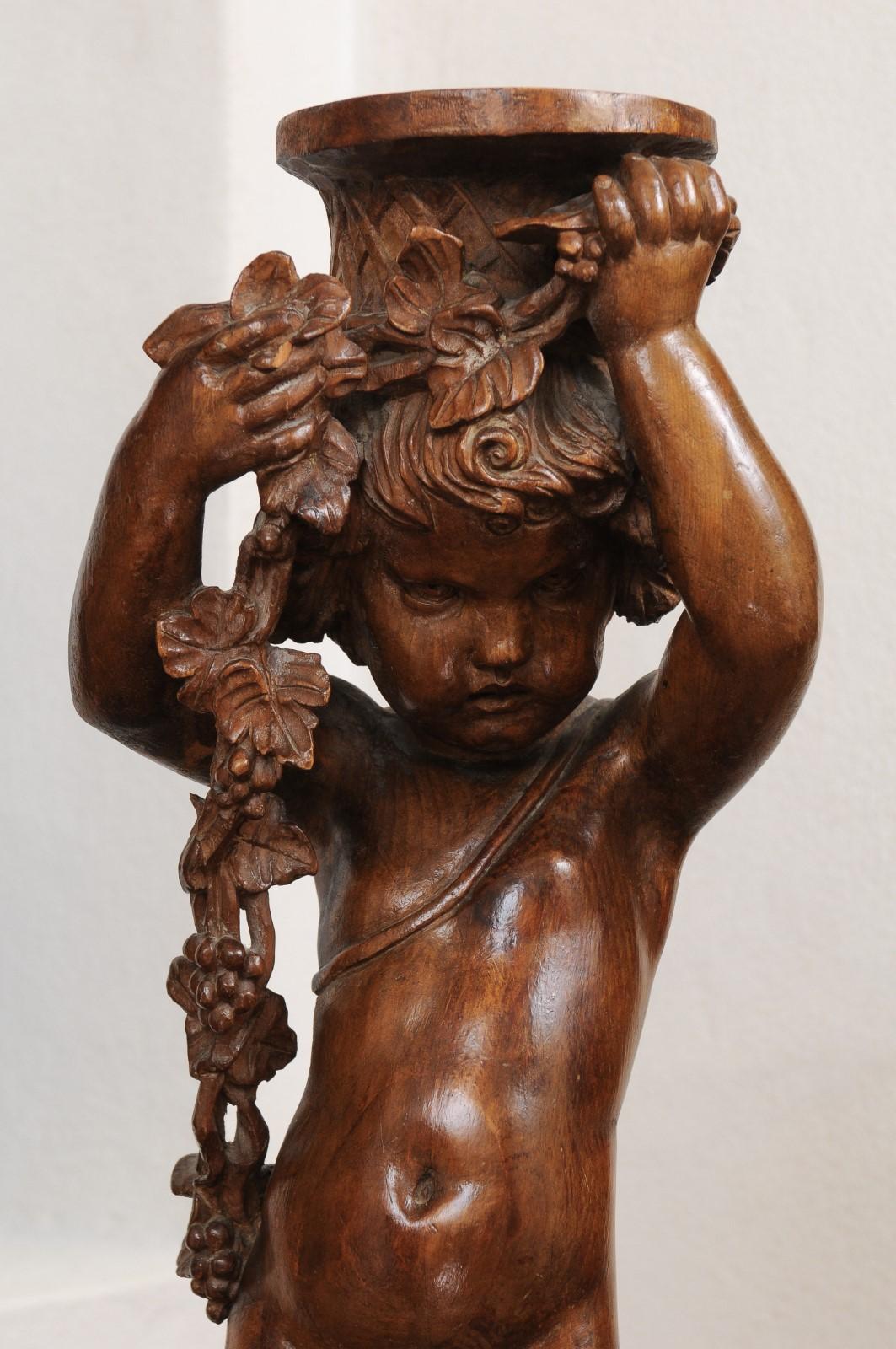 French Napoléon III 1860s Carved Walnut Sculpture of a Putto Carrying a Vessel For Sale 11