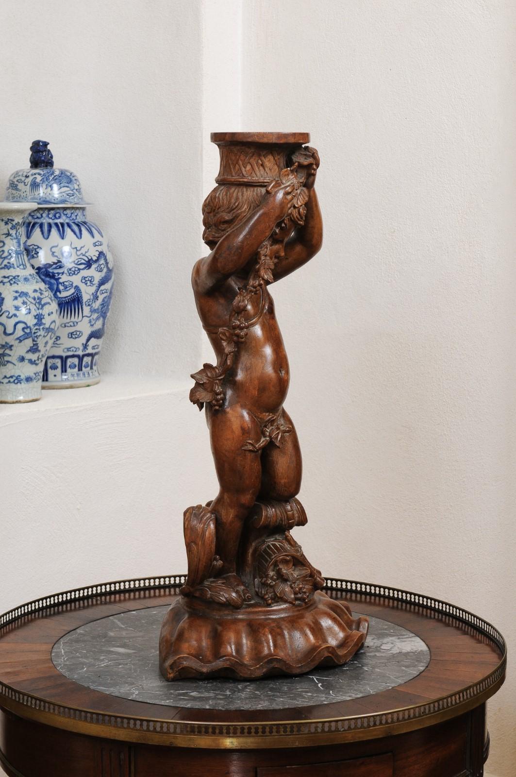 French Napoléon III 1860s Carved Walnut Sculpture of a Putto Carrying a Vessel For Sale 2
