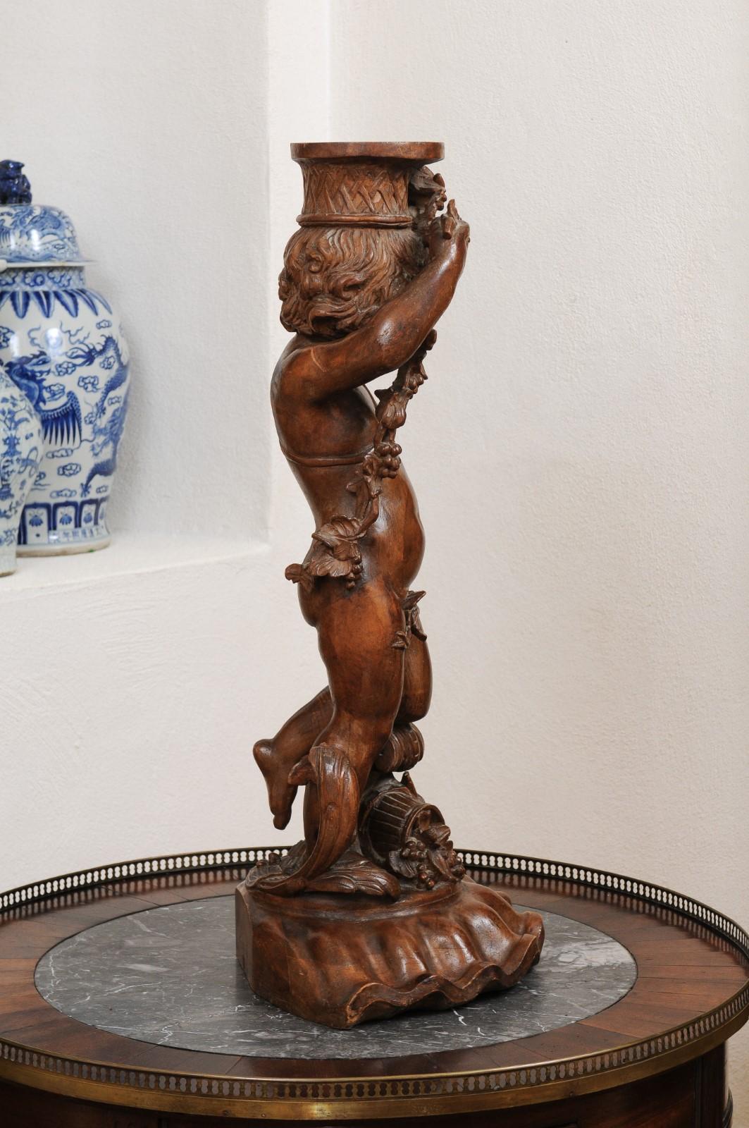 French Napoléon III 1860s Carved Walnut Sculpture of a Putto Carrying a Vessel For Sale 3