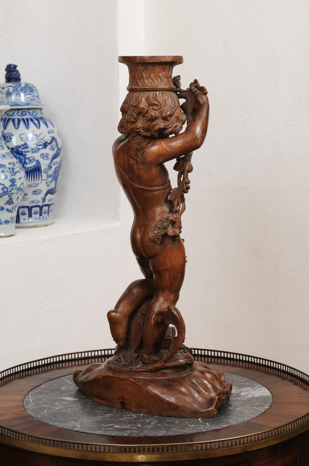 French Napoléon III 1860s Carved Walnut Sculpture of a Putto Carrying a Vessel For Sale 4